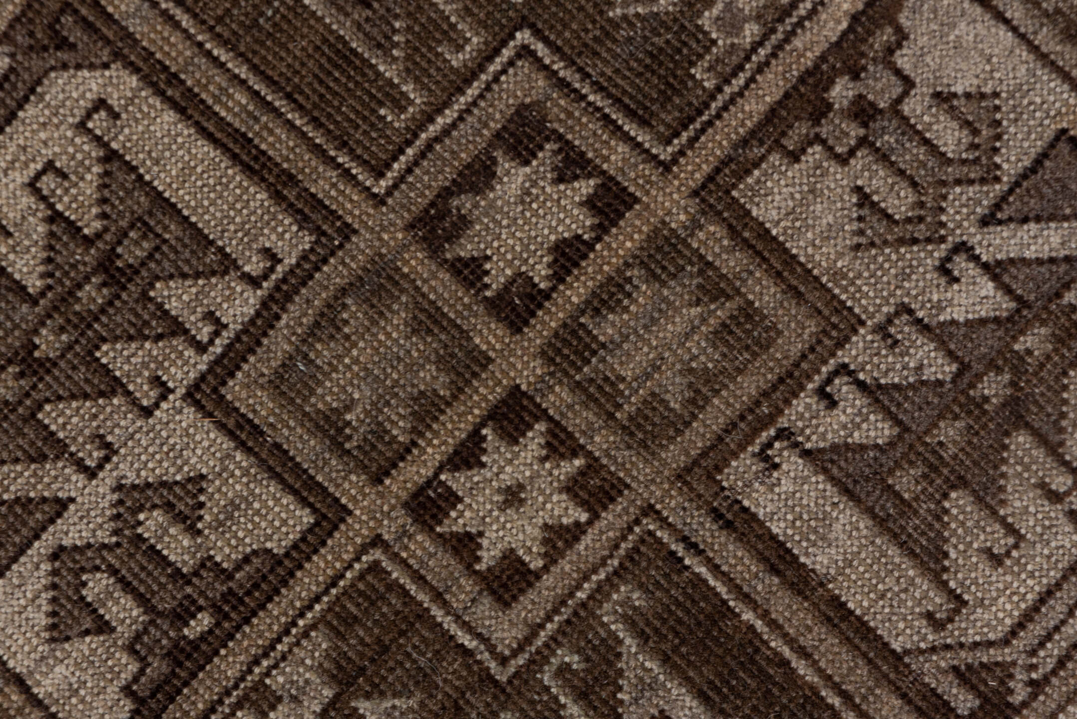 7' x 9' one-of-a-kind handmade antique Afghan rug. Color palette: brown, taupe, ivory, charcoal, camel, slate, beige, gray