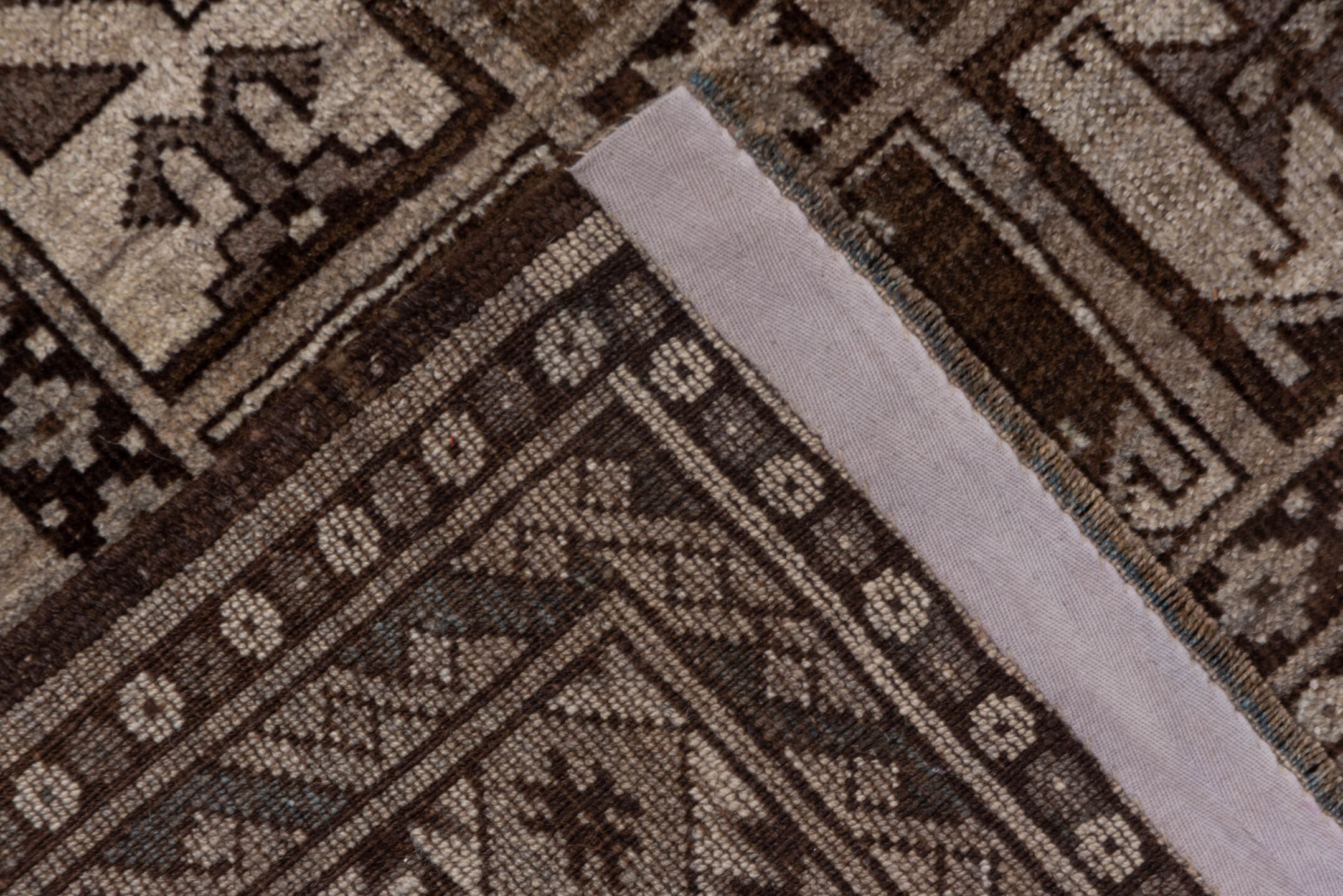 7' x 9' one-of-a-kind handmade antique Afghan rug. Color palette: brown, taupe, ivory, charcoal, camel, slate, beige, gray