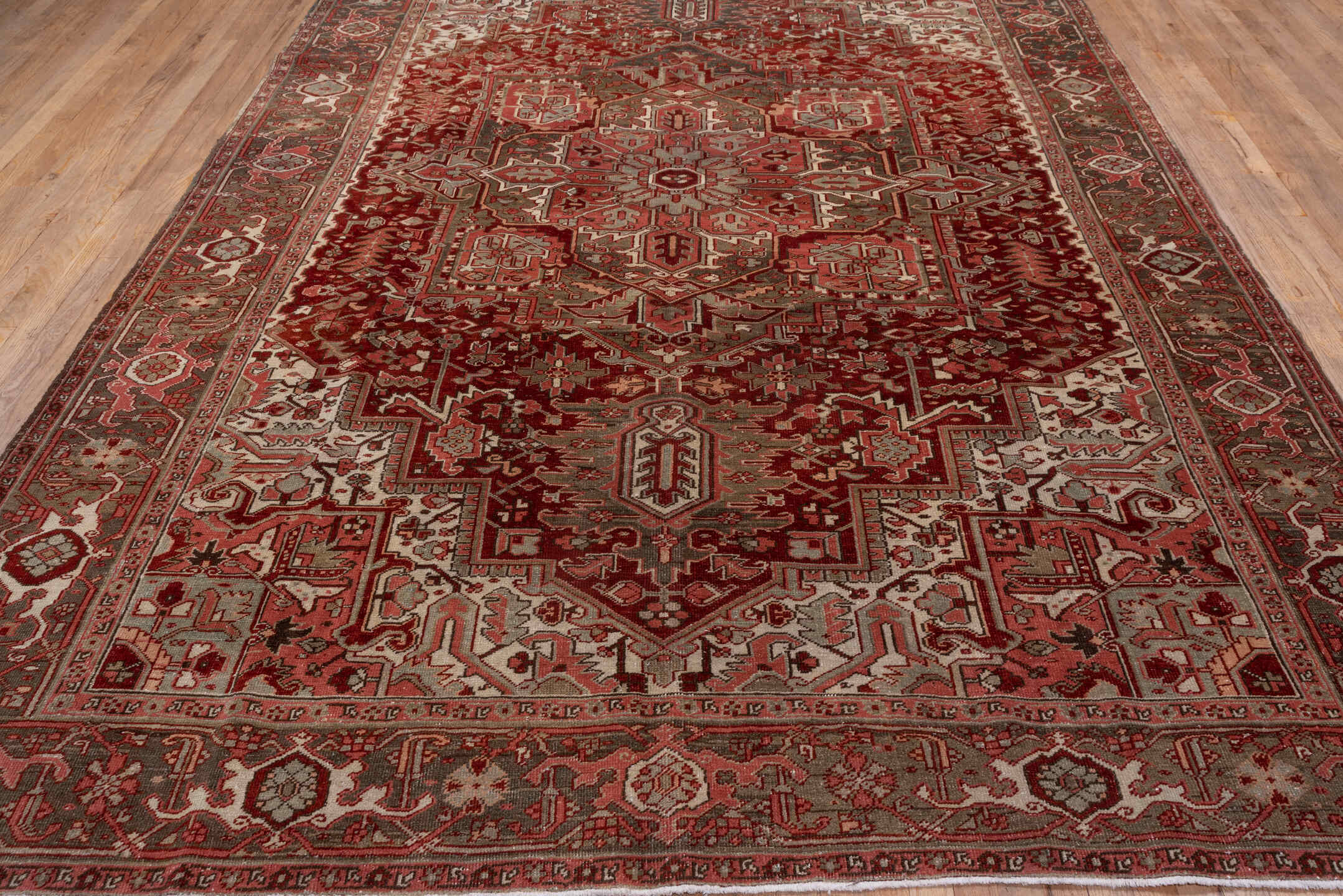8' x 12' one-of-a-kind handmade vintage Heriz large size rug. Color palette: brown, gray, light gray, pink, red