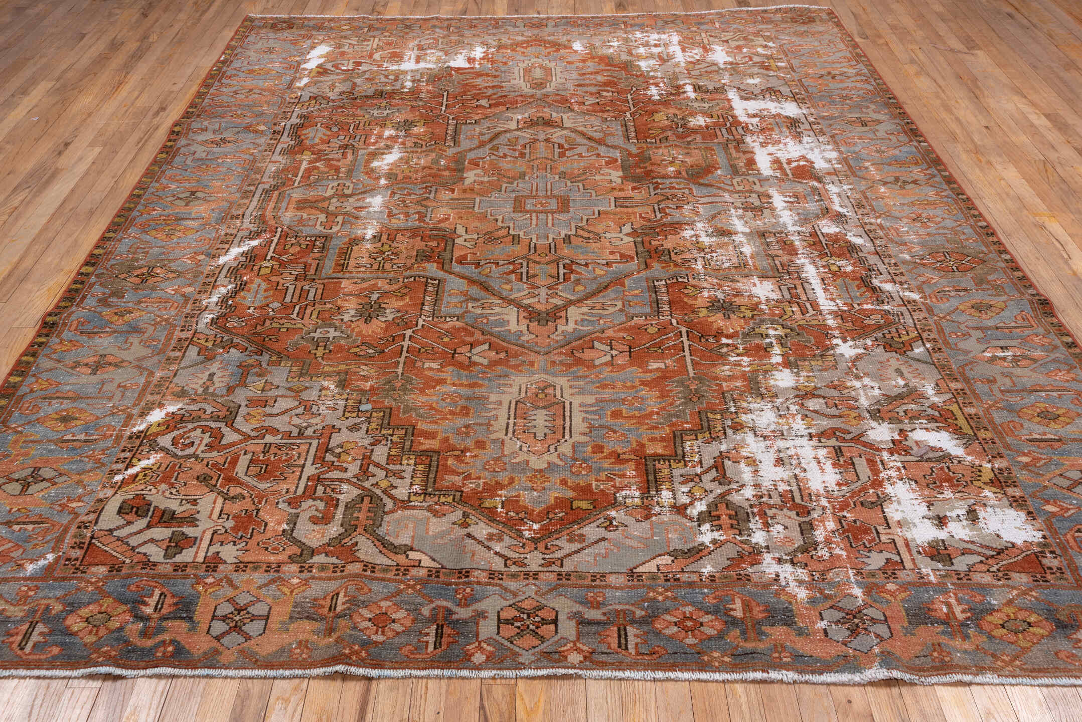 8' x 10' one-of-a-kind handmade antique Serapi large size rug. Color palette: terra cotta, light blue, ivory, rust, taupe