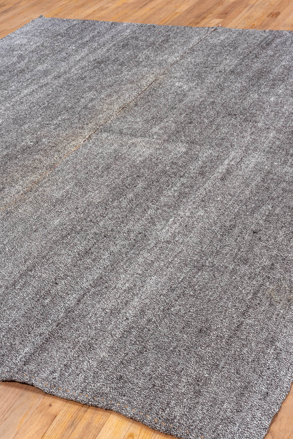 7' x 9' one-of-a-kind handmade antique Flatweave rug. Color palette: gray, charcoal, ivory, black