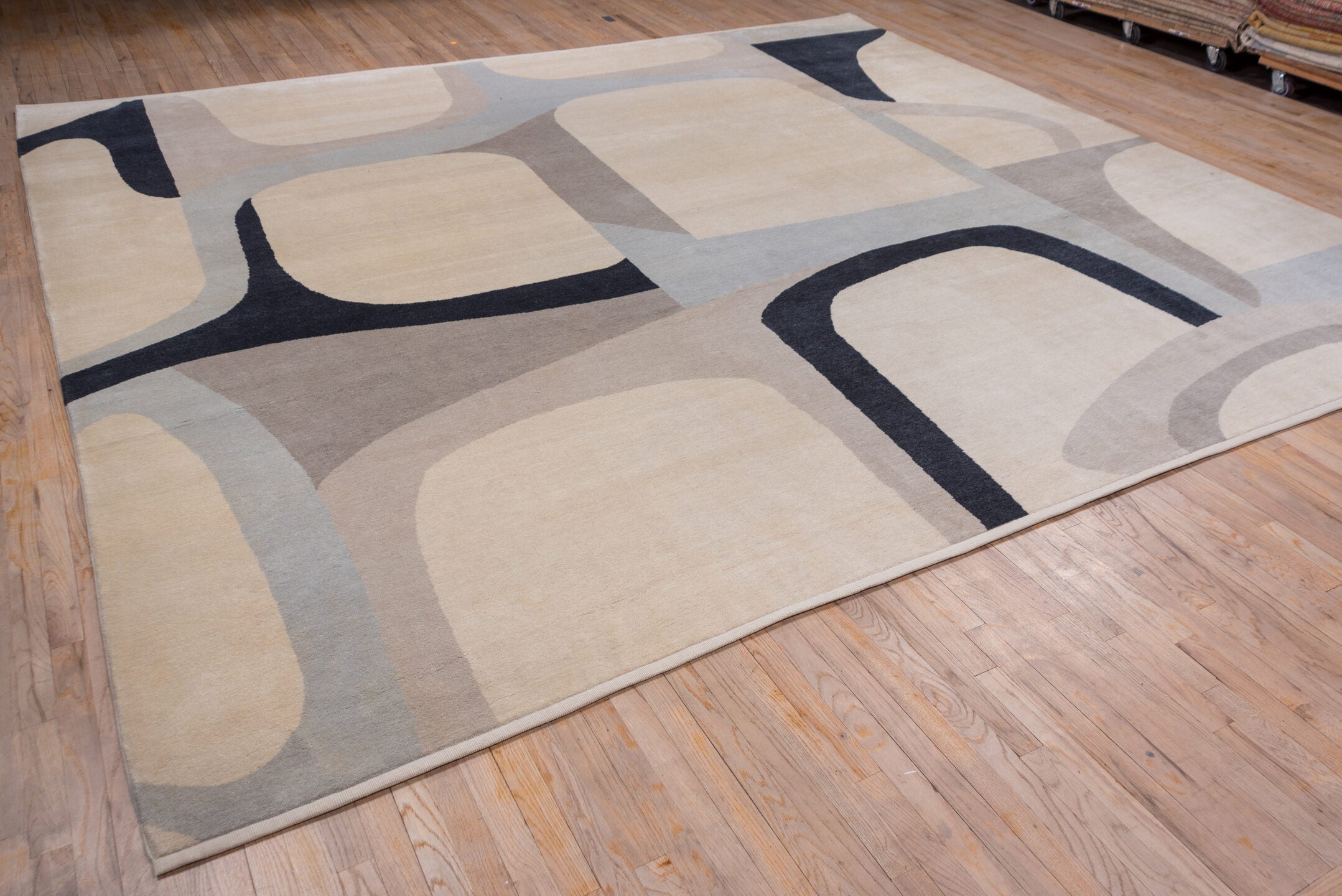 12' x 13' one-of-a-kind handmade vintage Art Deco oversize rug. Color palette: black, blue, brown, dark gray, gray