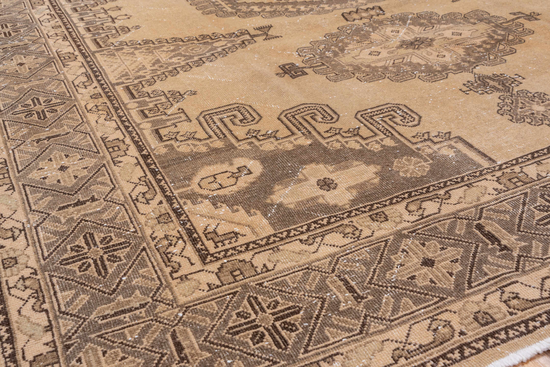 7' x 12' one-of-a-kind handmade antique Veece large size rug. Color palette: taupe, beige, brown, ivory, camel, charcoal