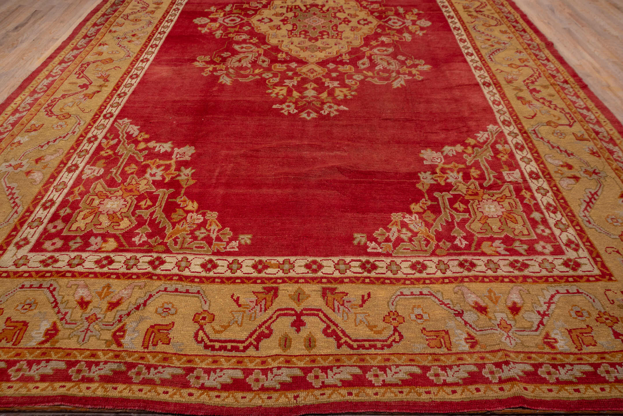 12' x 20' one-of-a-kind handmade antique Oushak oversize rug. Color palette: terra cotta, gold, rust, muted blue, ivory