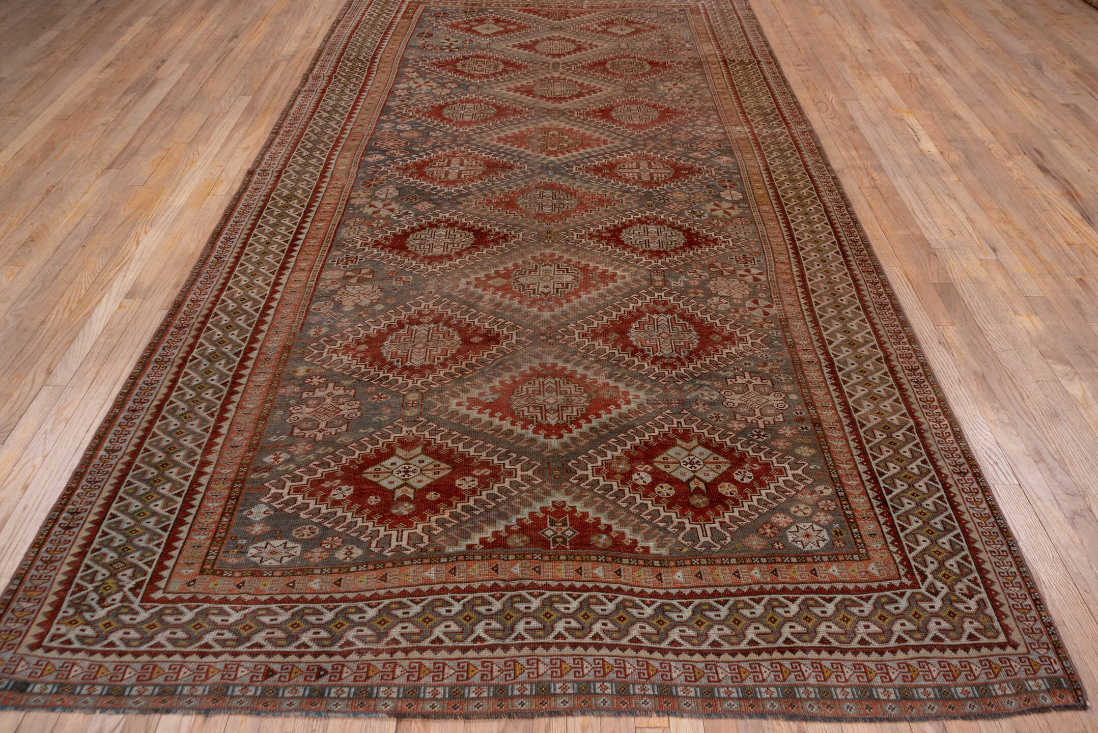 6' x 12' one-of-a-kind handmade antique Shiraz large size rug. Color palette: rust, blue_gray, ivory, taupe, terra_cotta