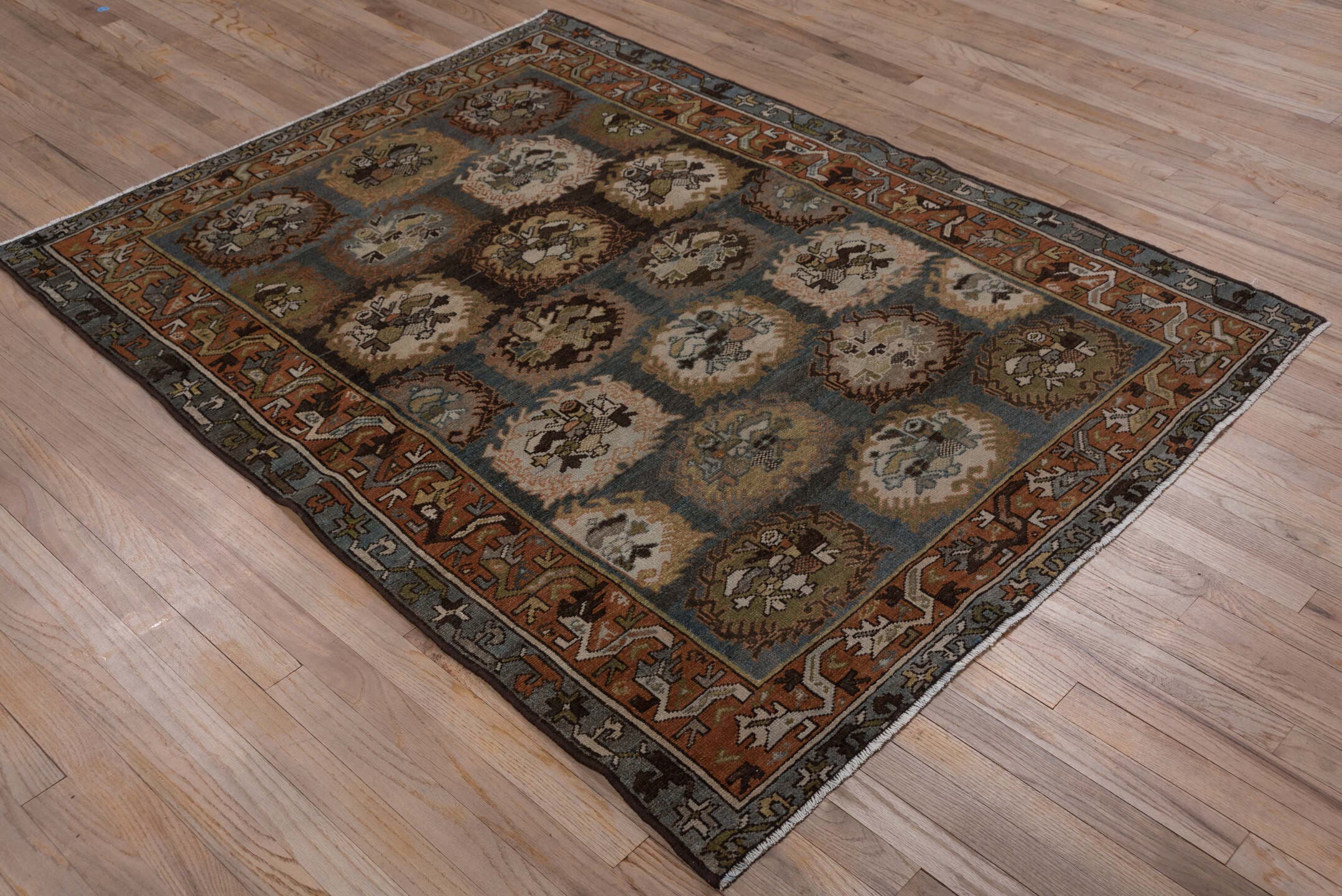 4' x 6' one-of-a-kind handmade antique Baktiary rug. Color palette: sky blue, rust, ivory, brown, camel, slate, taupe, olive