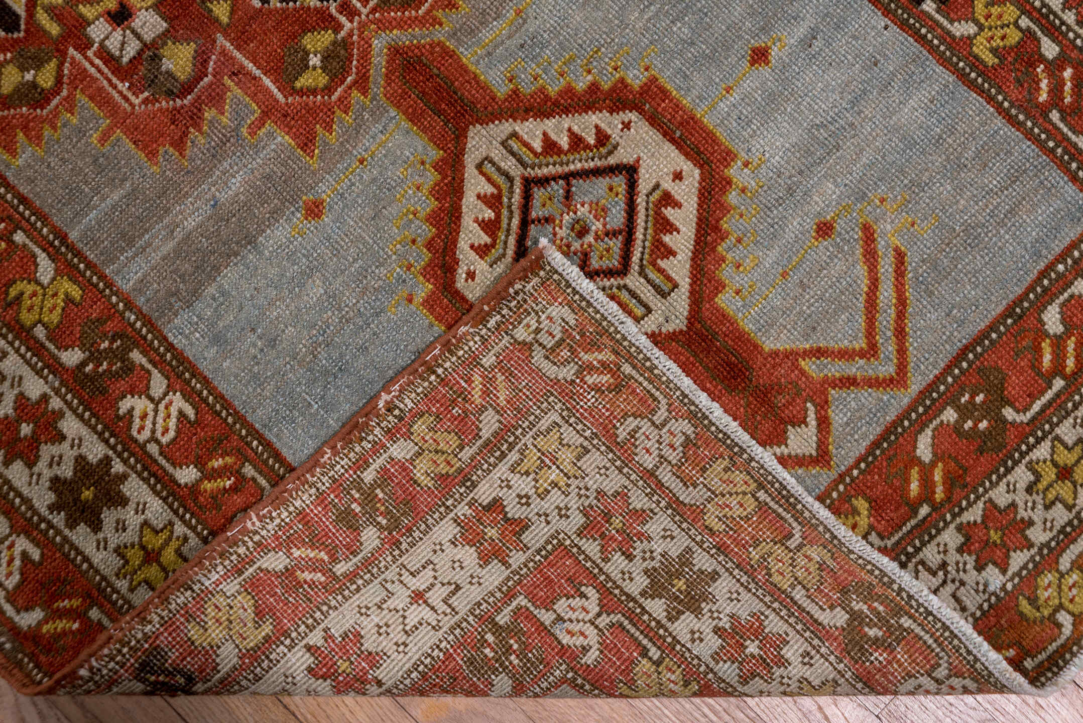 3' x 14' one-of-a-kind handmade antique Heriz runner rug. Color palette: rust, light blue, ivory, gold, brown, charcoal