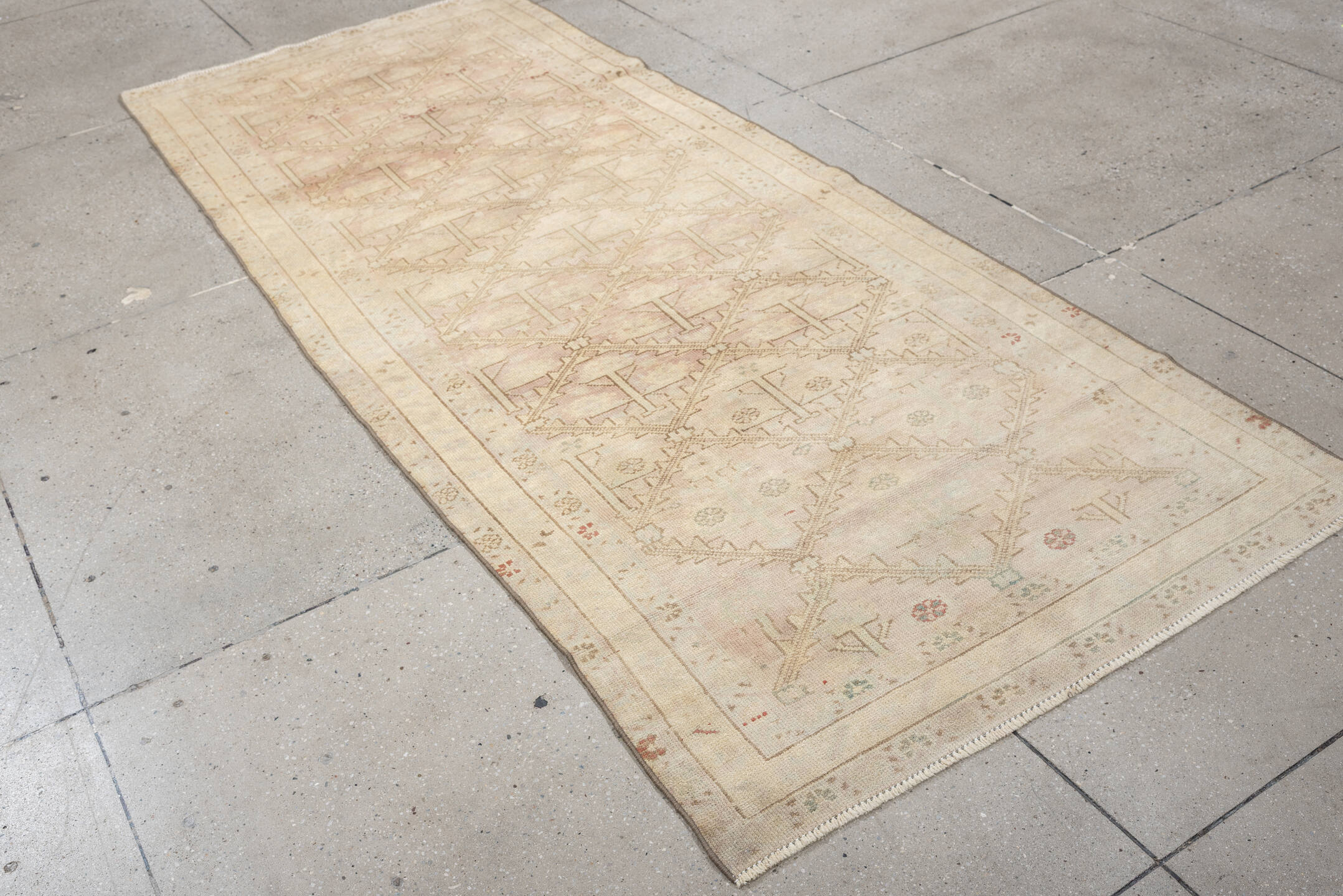 3' x 9' one-of-a-kind handmade antique Anatolian runner rug. Color palette: ivory, blush, taupe, sage, terracotta, camel
