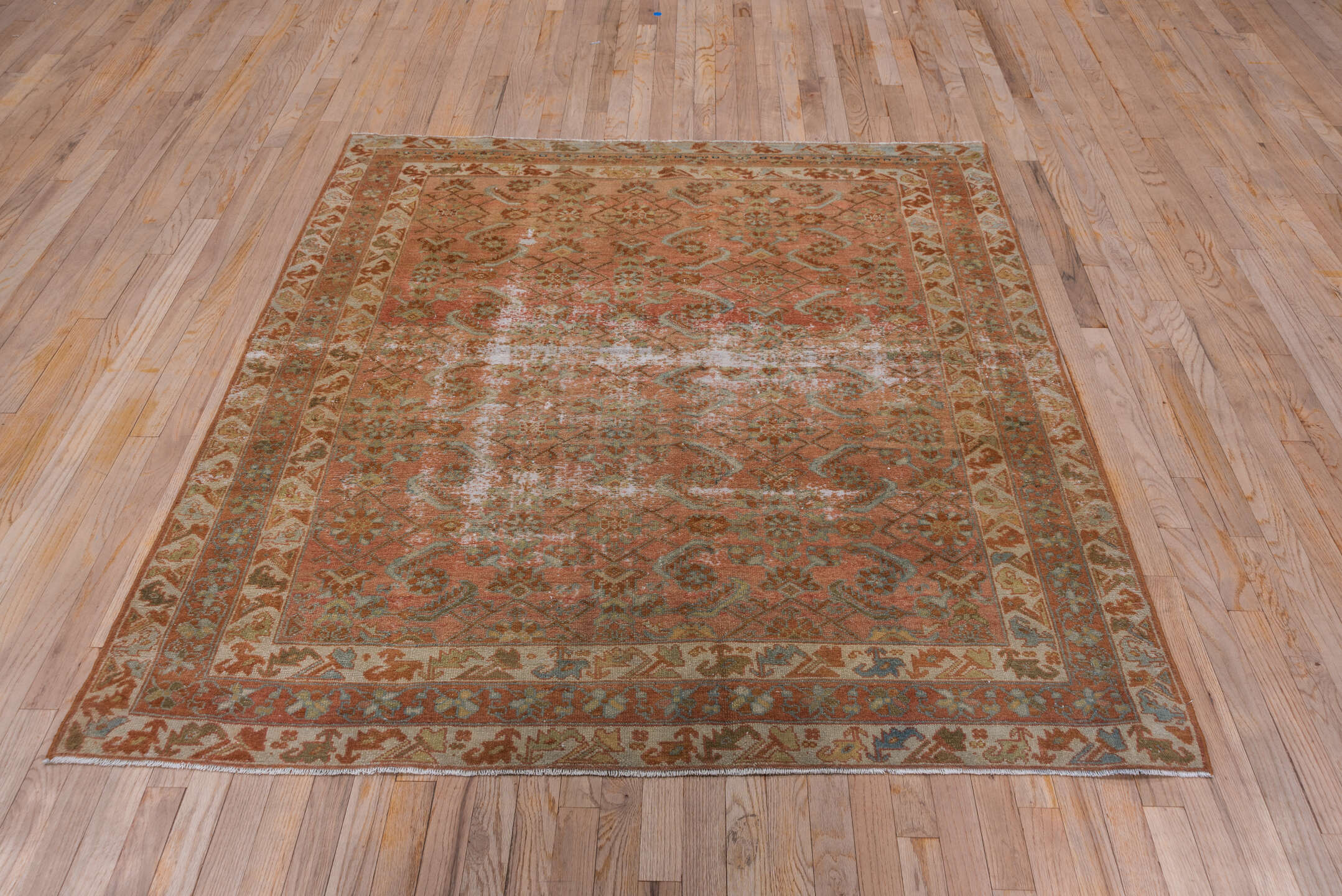 5' x 6' one-of-a-kind handmade antique Malayer rug. Color palette: terra cotta, rust, ivory, sage, camel, brown, pale blue