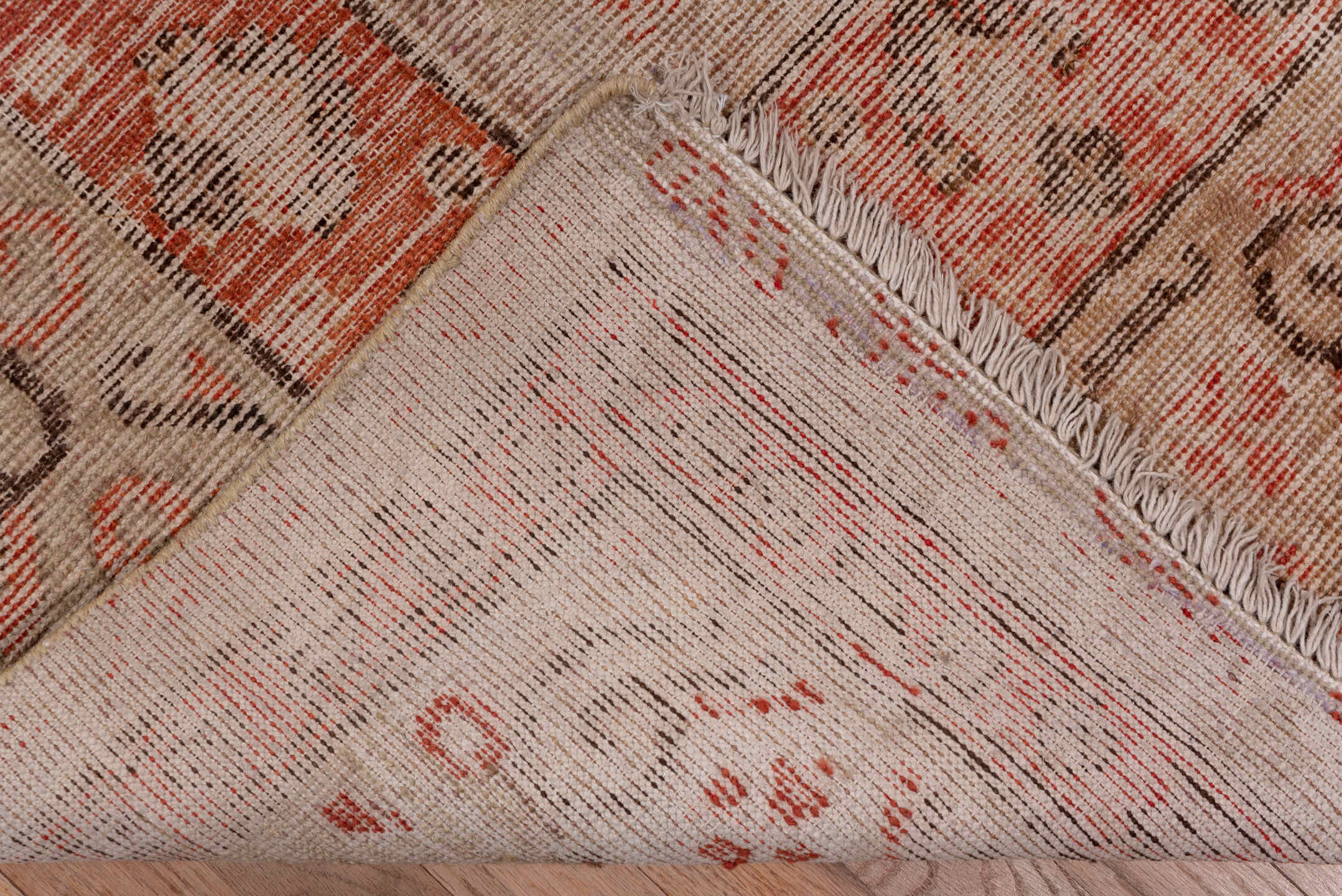5' x 11' one-of-a-kind handmade antique Khotan rug. Color palette: ivory, terra cotta, taupe, charcoal, rose, camel