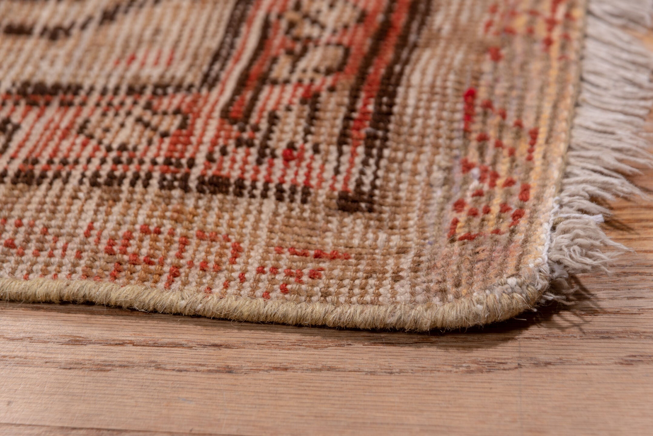 5' x 11' one-of-a-kind handmade antique Khotan rug. Color palette: ivory, terra cotta, taupe, charcoal, rose, camel