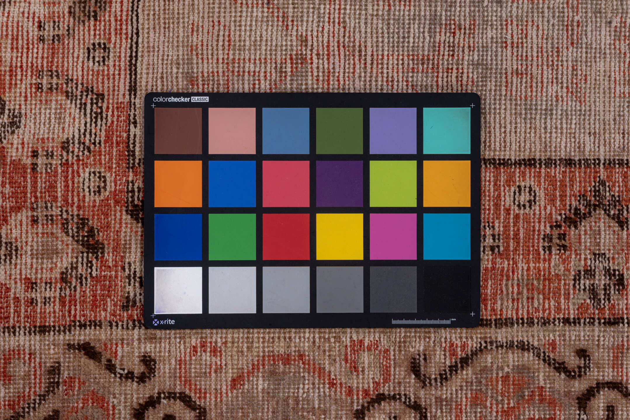 5' x 11' one-of-a-kind handmade vintage Khotan rug. Color palette: brown, gray, light gray, pink, red