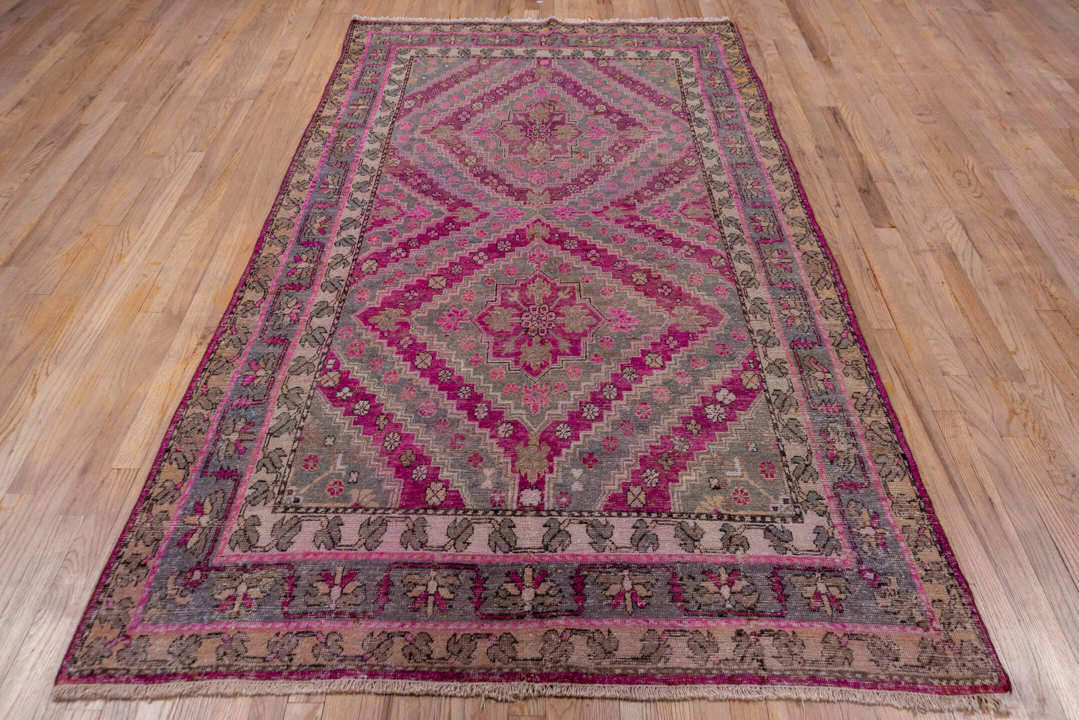 4' x 8' one-of-a-kind handmade vintage Khotan rug. Color palette: brown, gray, pink, red