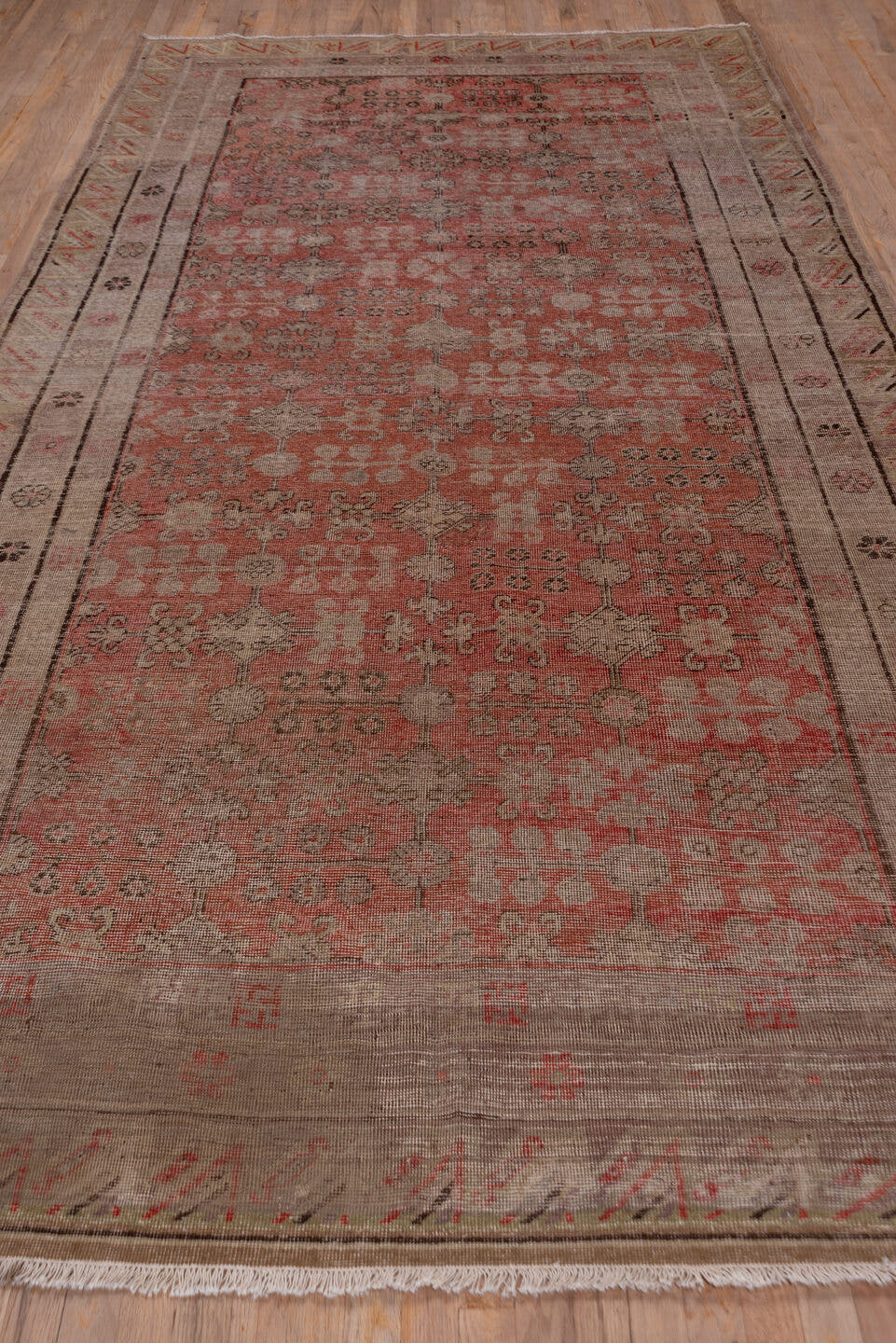6' x 12' one-of-a-kind handmade antique Khotan large size rug. Color palette: taupe, coral, rose, camel, brown, charcoal