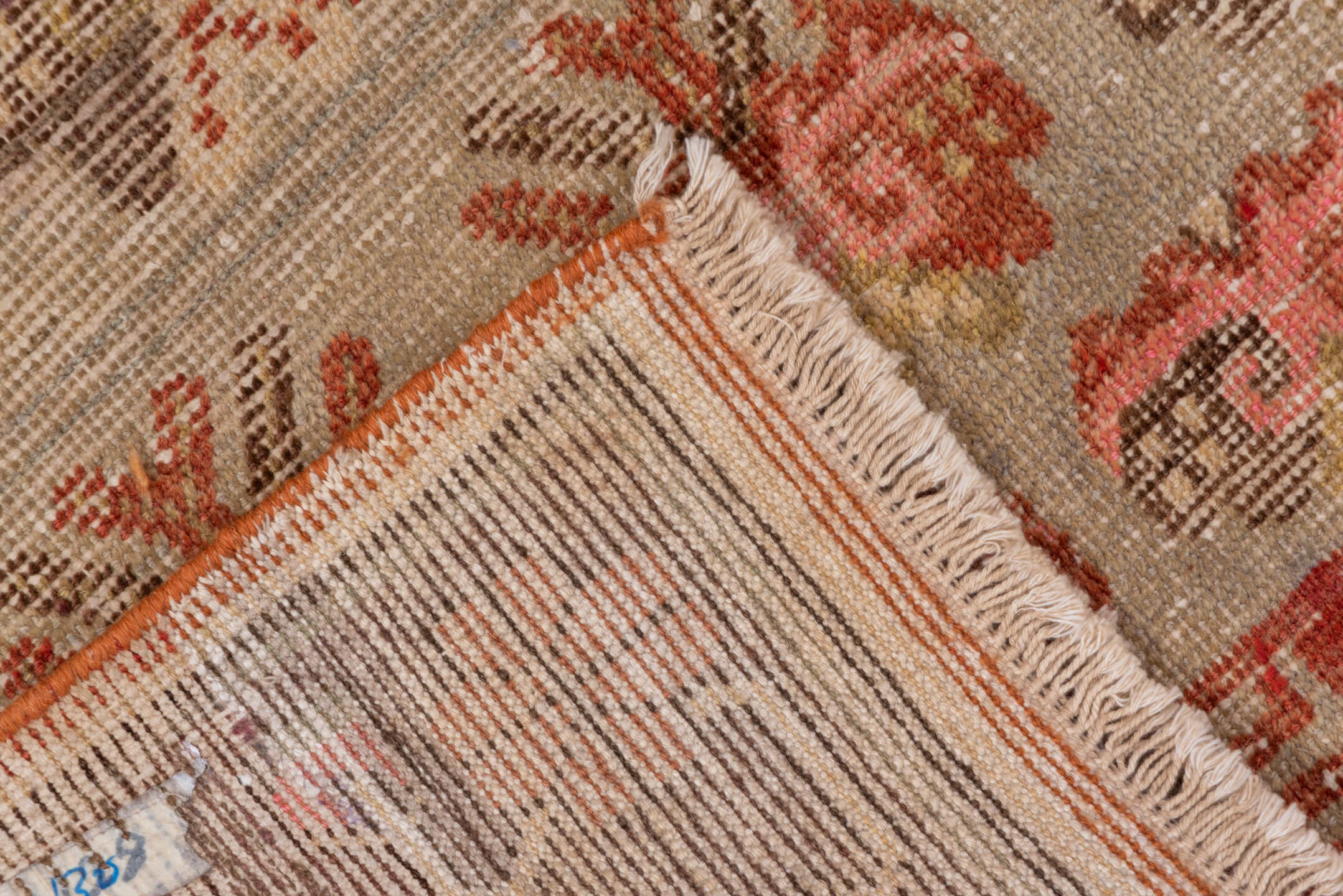 4' x 7' one-of-a-kind handmade vintage Khotan rug. Color palette: brown, off-white, orange, pink