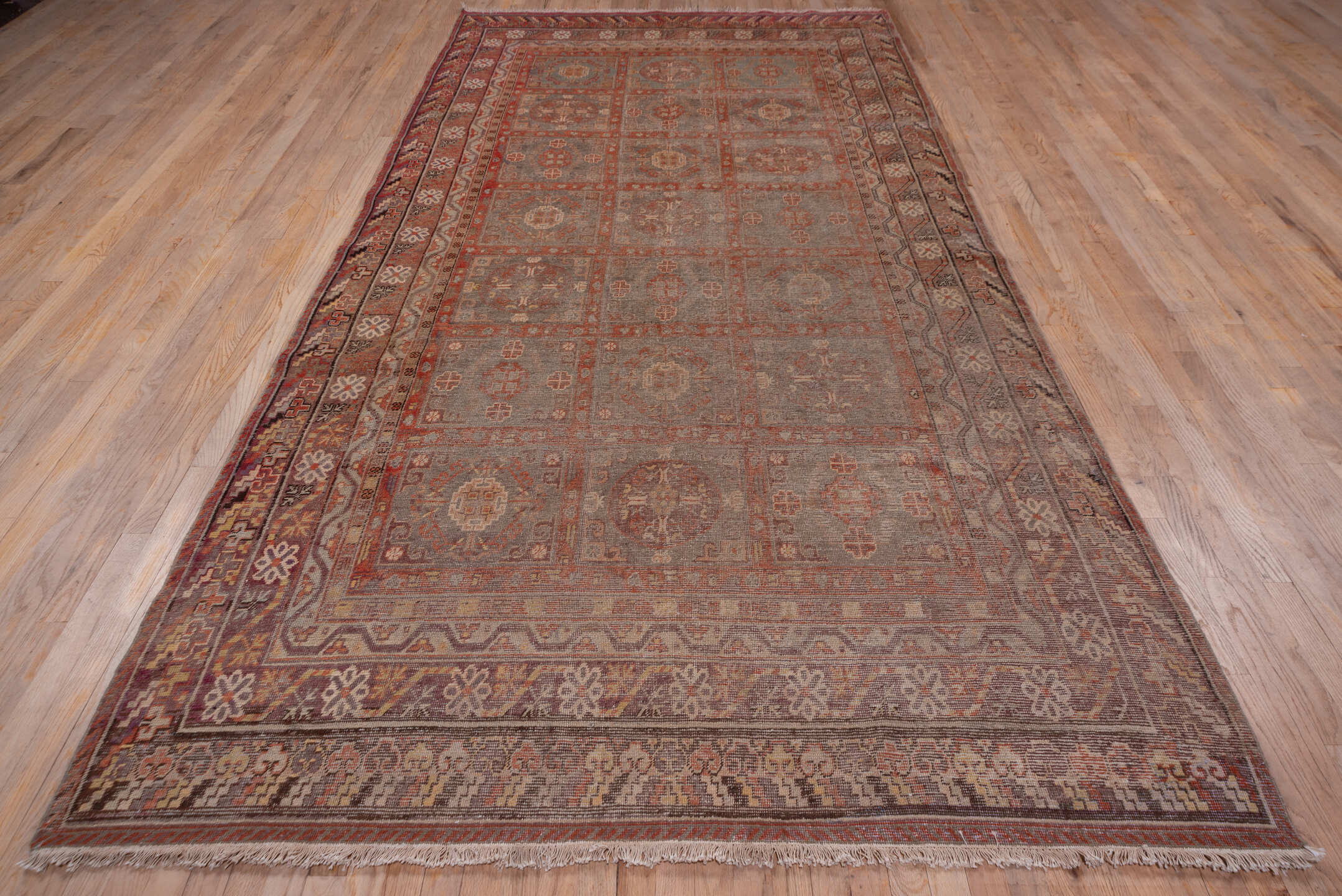 6' x 12' one-of-a-kind handmade vintage Khotan large size rug. Color palette: brown, gray, pink, red