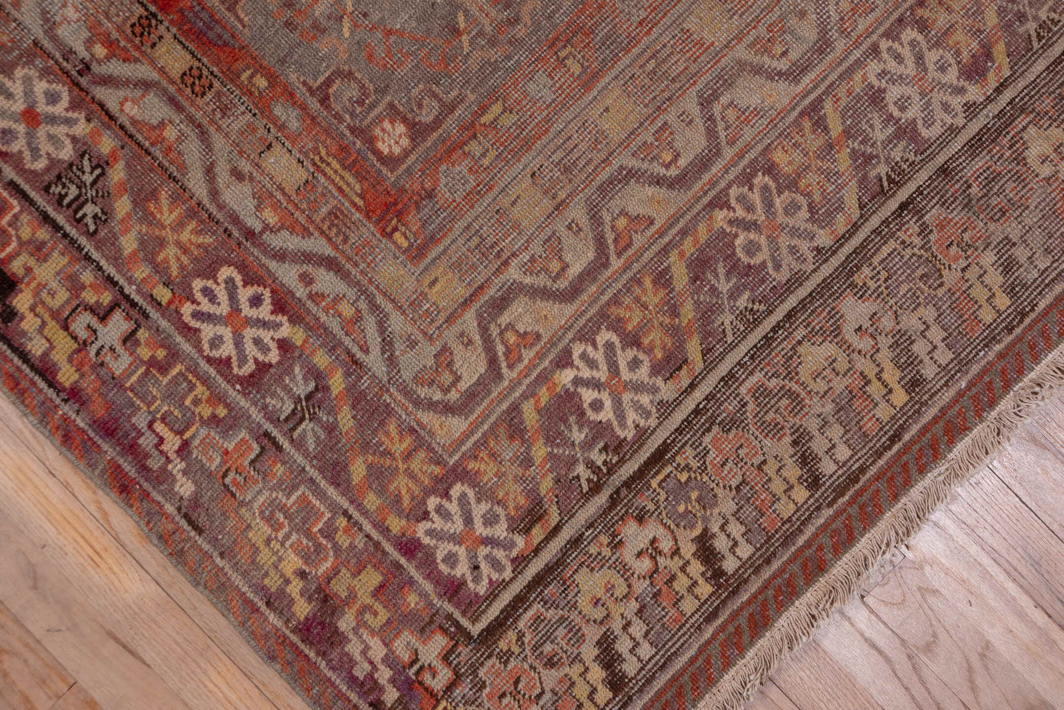 6' x 12' one-of-a-kind handmade vintage Khotan large size rug. Color palette: brown, gray, pink, red