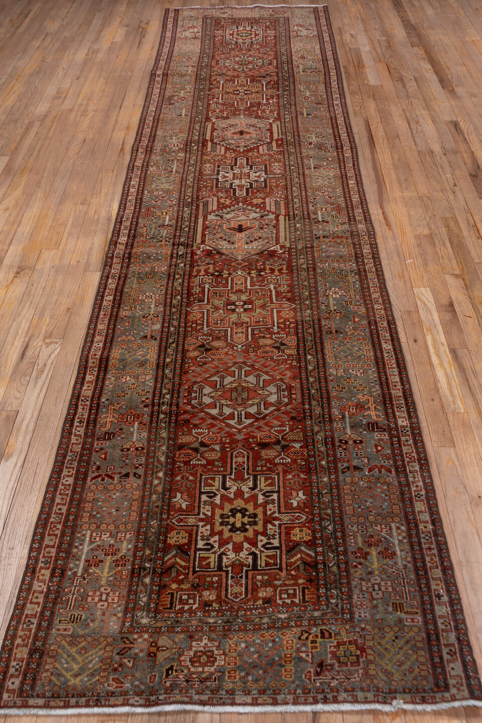 3' x 14' one-of-a-kind handmade antique Karaje runner rug. Color palette: rust, blue-gray, ivory, burgundy, taupe, camel
