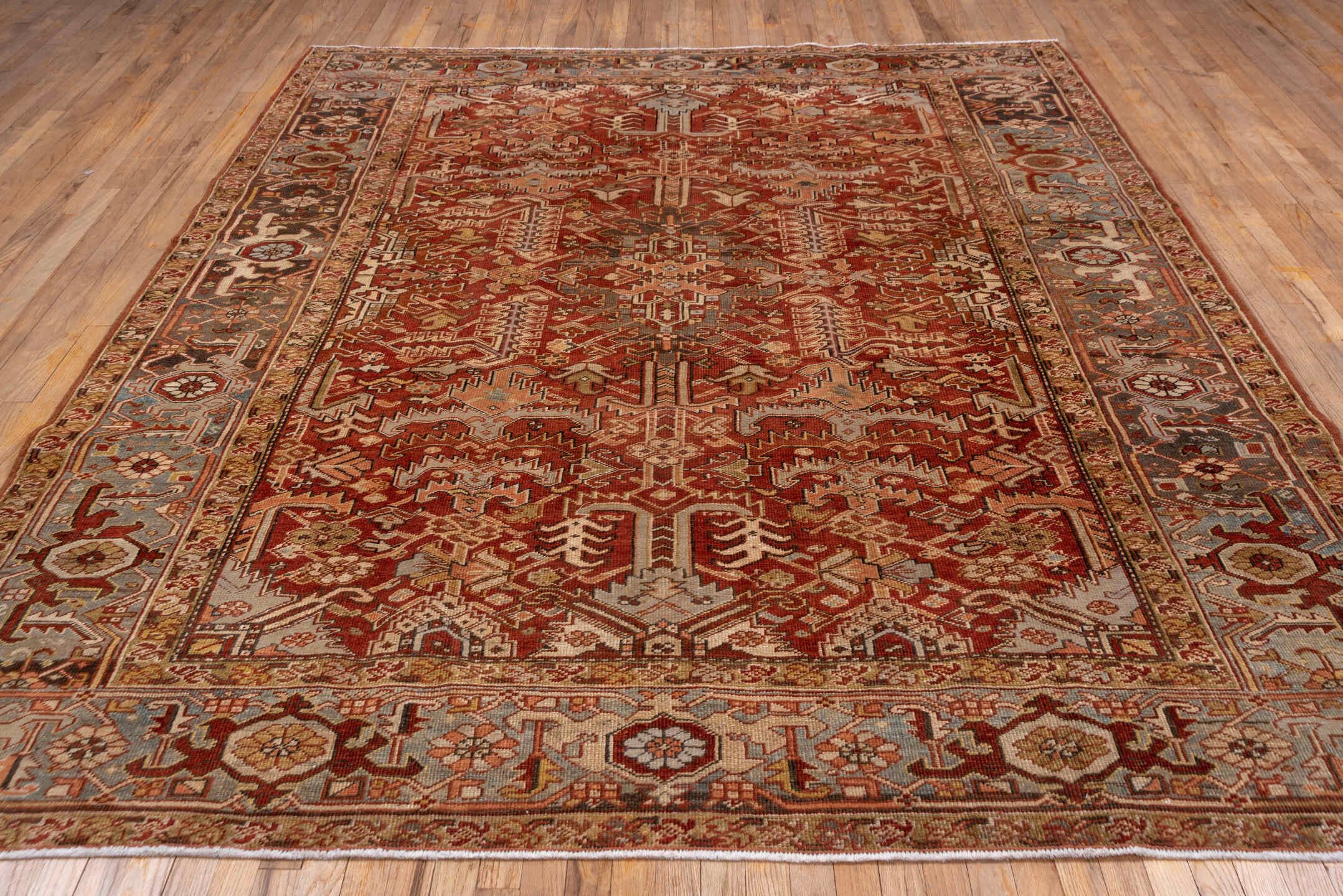 8' x 10' one-of-a-kind handmade antique Heriz large size rug. Color palette: rust, sky blue, ivory, terra cotta, camel