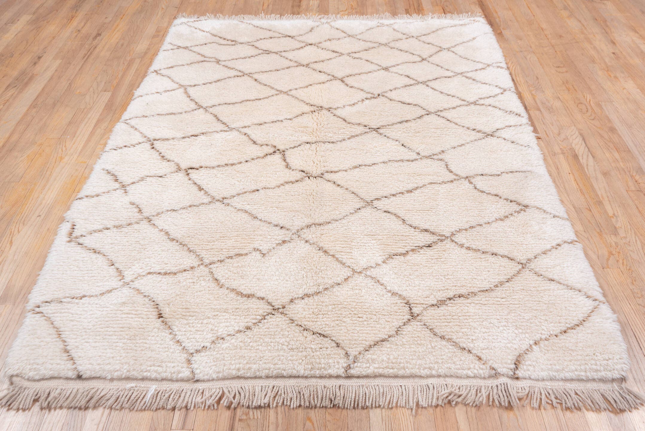 5' x 7' one-of-a-kind handmade vintage Moroccan rug. Color palette: ivory, taupe, cream, beige, gray