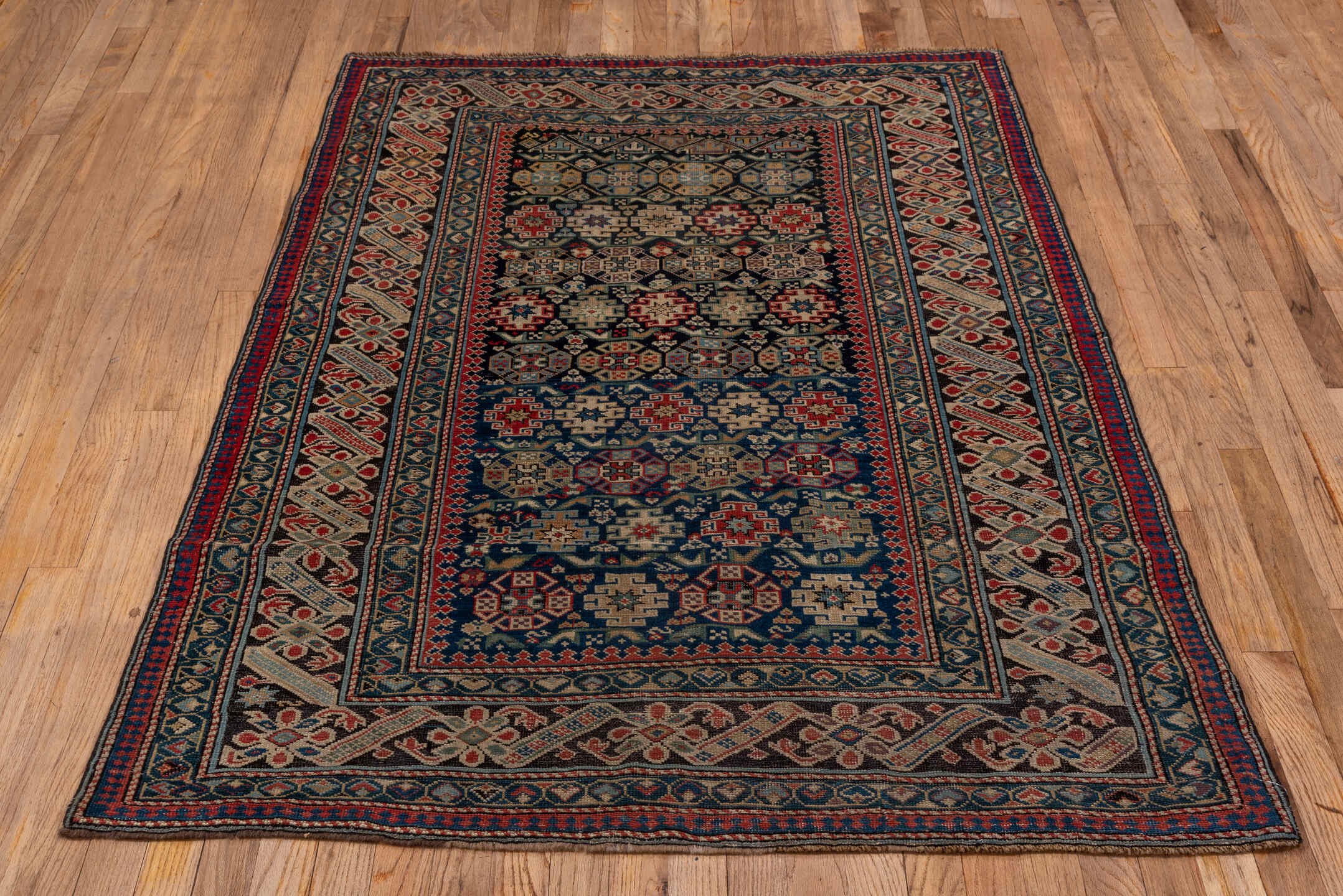 3' x 5' one-of-a-kind handmade antique Chichi small size rug. Color palette: navy, ivory, red, sky_blue, charcoal, camel