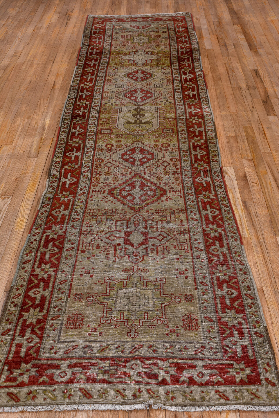 3' x 12' one-of-a-kind handmade antique Karaje runner rug. Color palette: ivory, rust, brick, taupe, camel, brown, rose