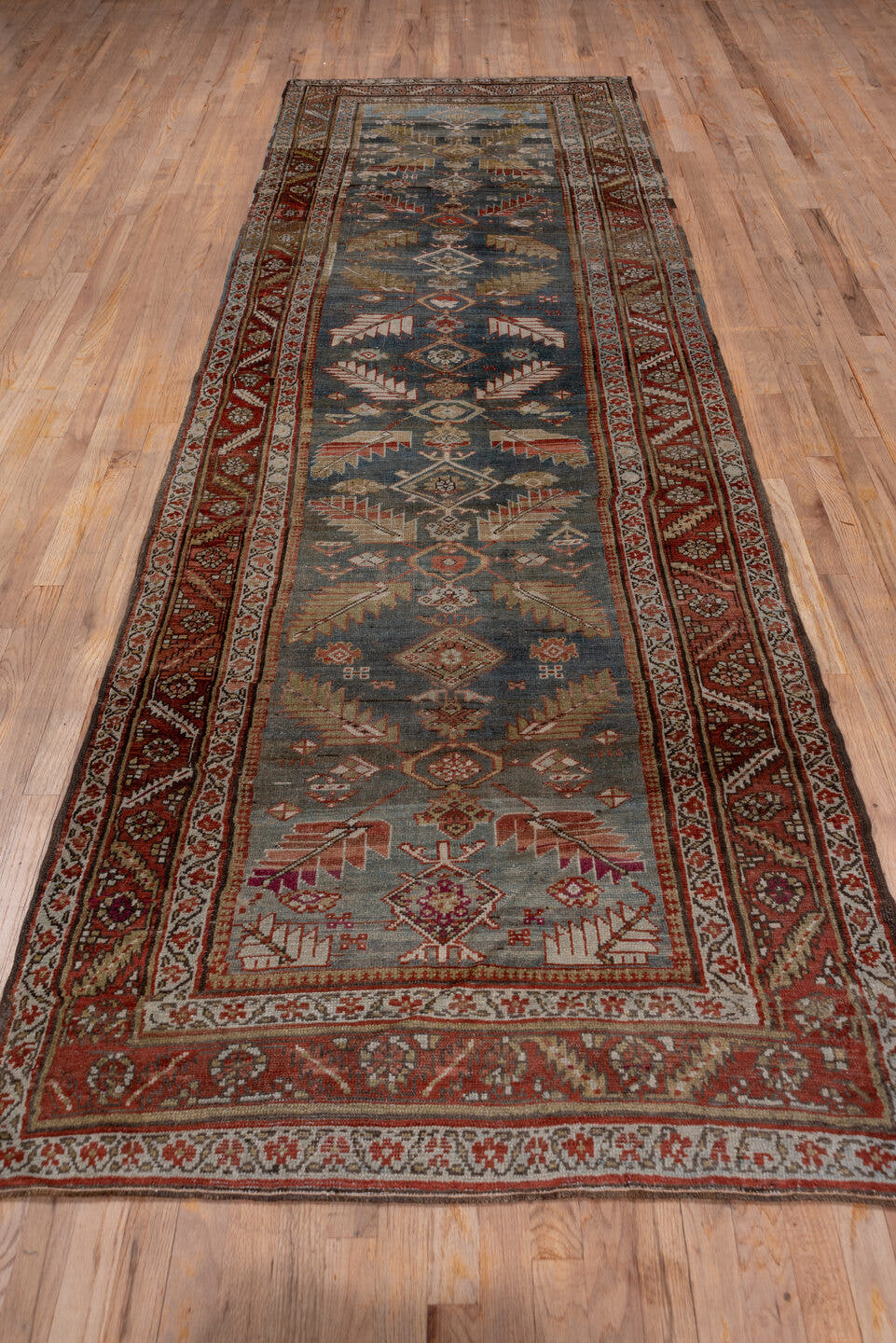 3' x 12' one-of-a-kind handmade antique NW Persian runner rug. Color palette: blue, rust, ivory, camel, burgundy, taupe