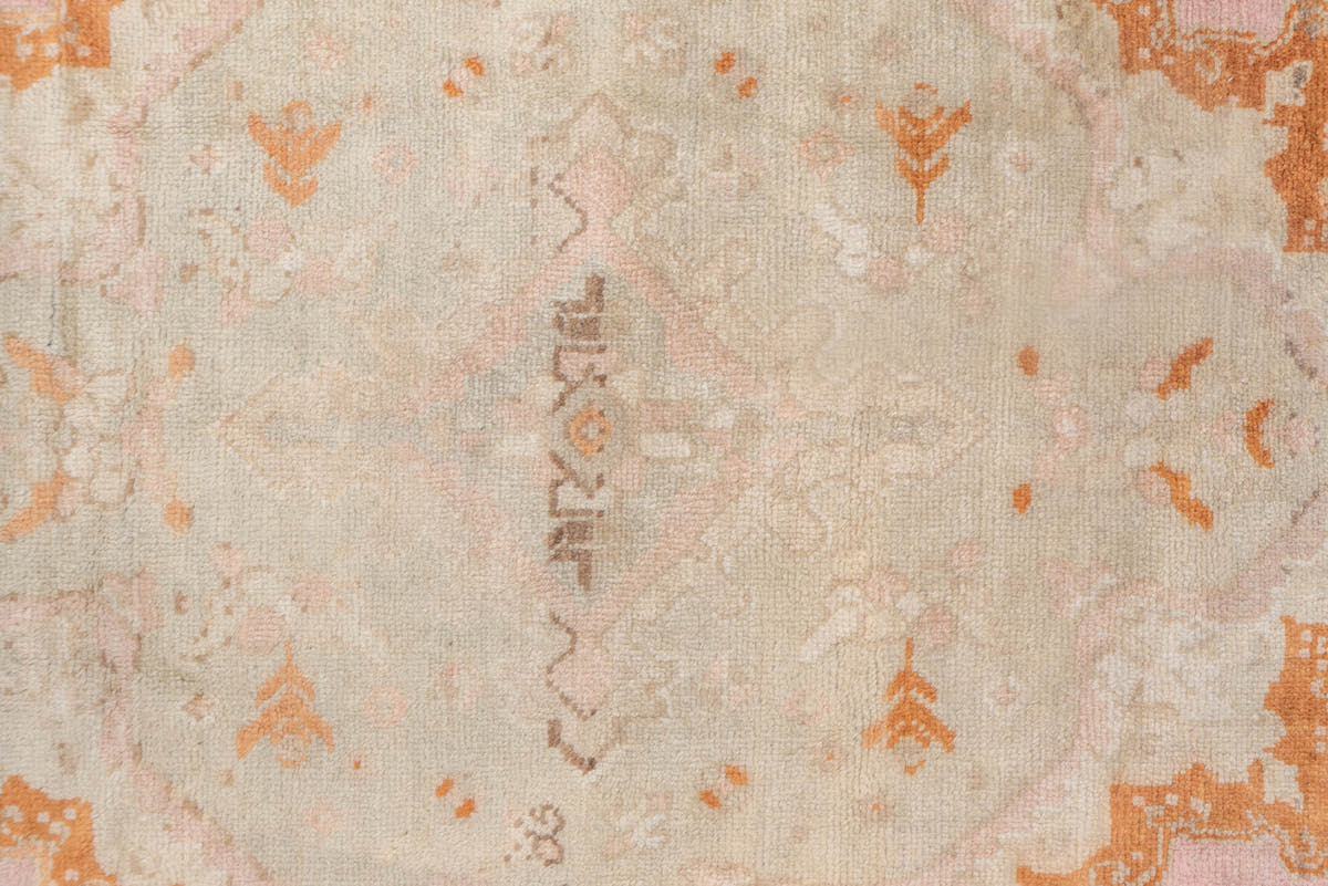 10' x 21' one-of-a-kind handmade antique Oushak rug. Color palette: ivory, blush, peach, taupe, camel, sage, pink
