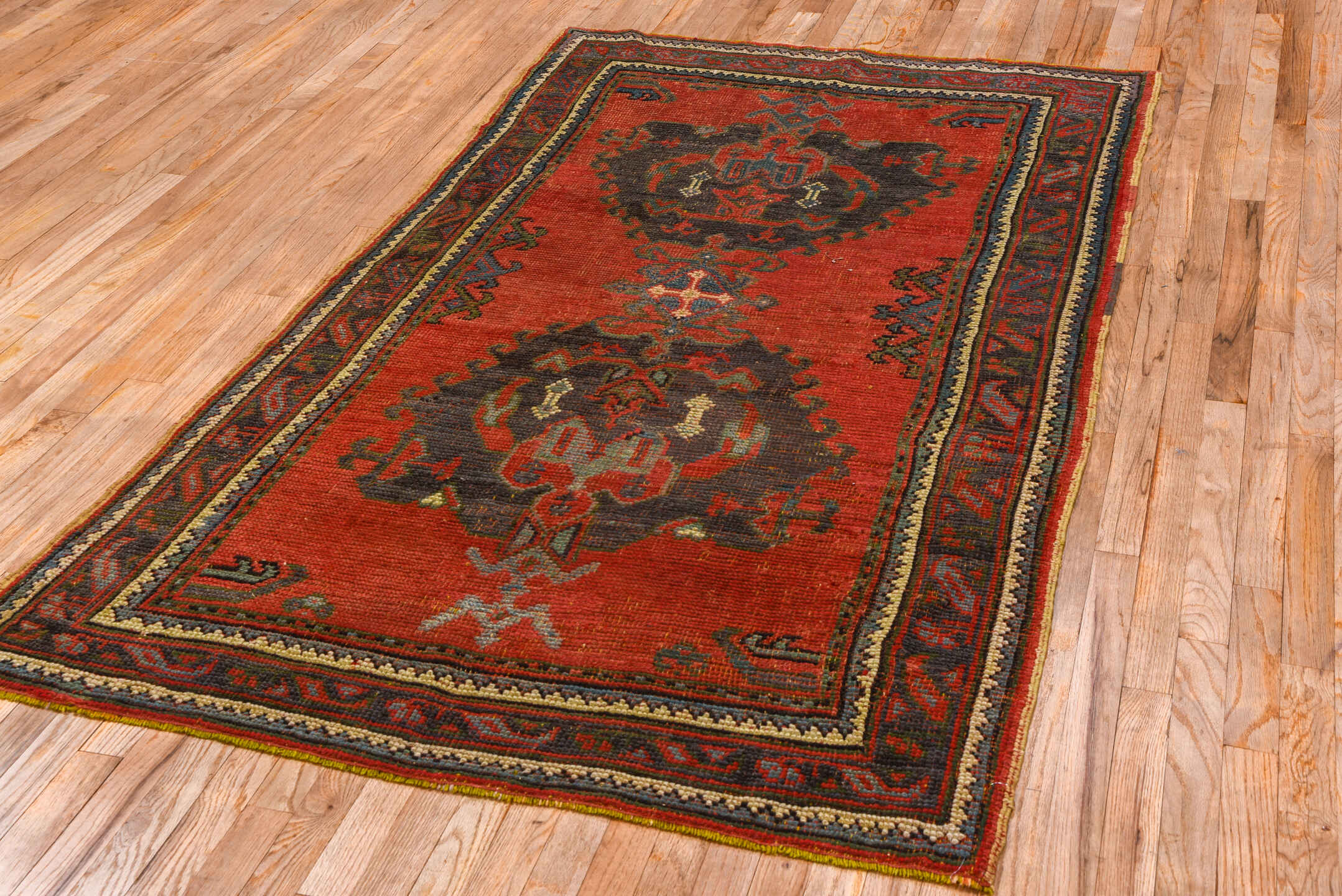 4' x 7' one-of-a-kind handmade antique Oushak rug. Color palette: rust, charcoal, crimson, ivory, slate, terra cotta