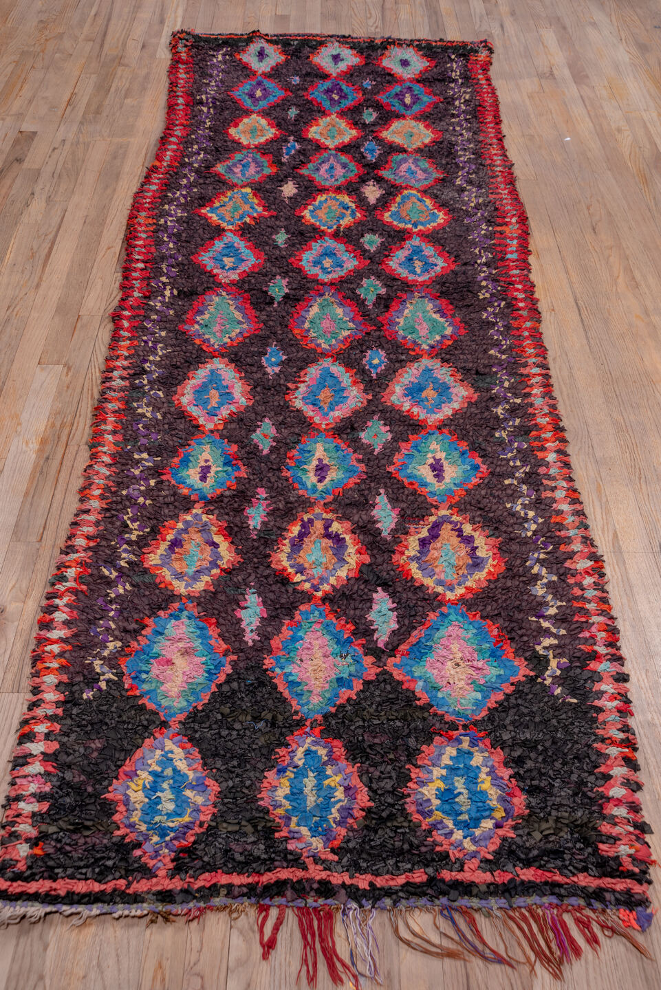 3' x 10' one-of-a-kind handmade vintage Rag Rug runner rug. Color palette: blue, brown, dim gray, gray, pink, red
