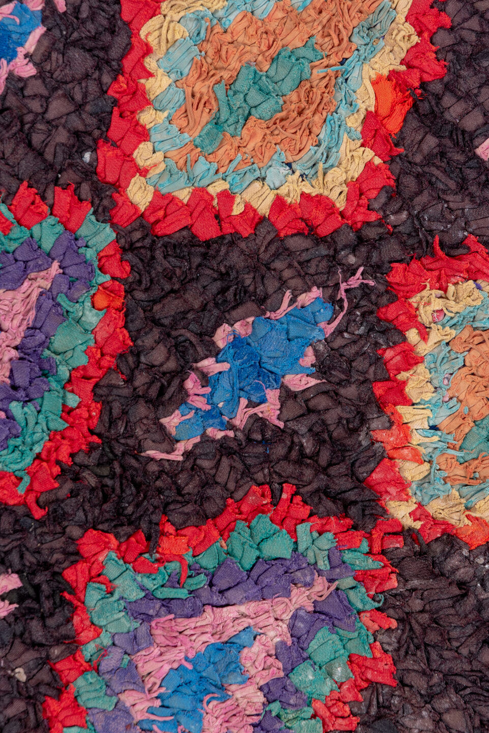 3' x 10' one-of-a-kind handmade vintage Rag Rug runner rug. Color palette: charcoal, crimson, turquoise, lavender, coral