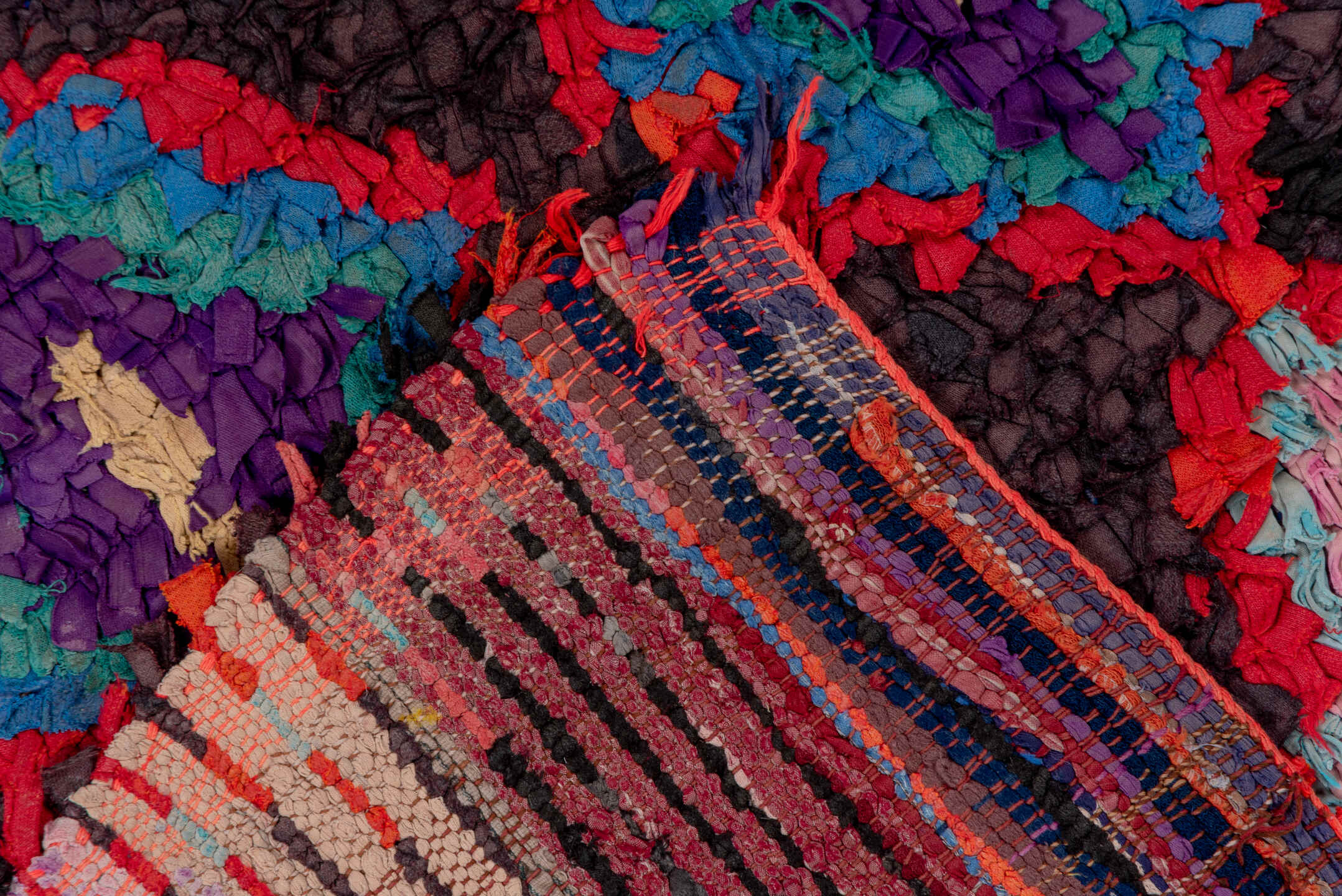 3' x 10' one-of-a-kind handmade vintage Rag Rug runner rug. Color palette: charcoal, crimson, turquoise, lavender, coral
