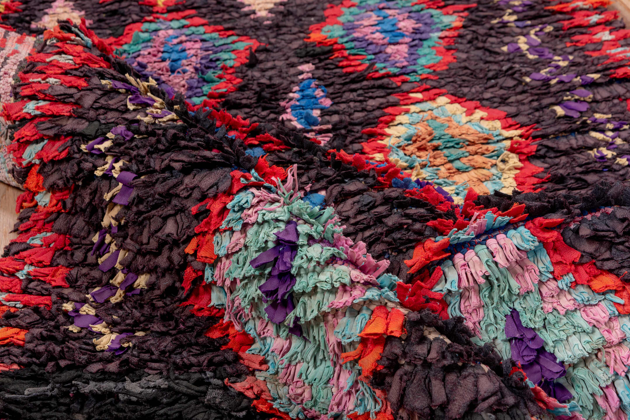 3' x 10' one-of-a-kind handmade vintage Rag Rug runner rug. Color palette: charcoal, crimson, turquoise, lavender, coral