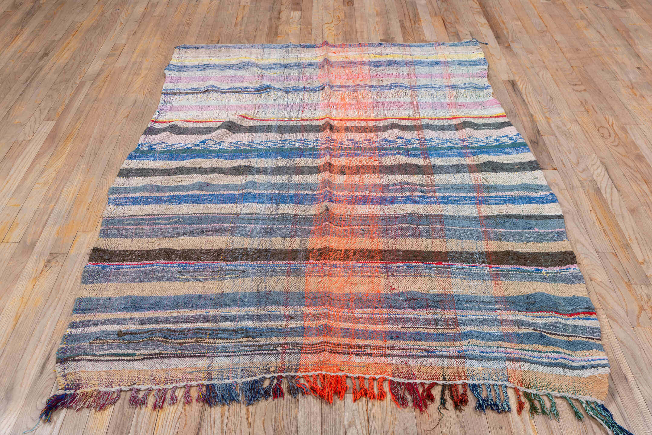 5' x 6' one-of-a-kind handmade vintage Textile rug. Color palette: blue, brown, gray, light gray, off-white, pink, red