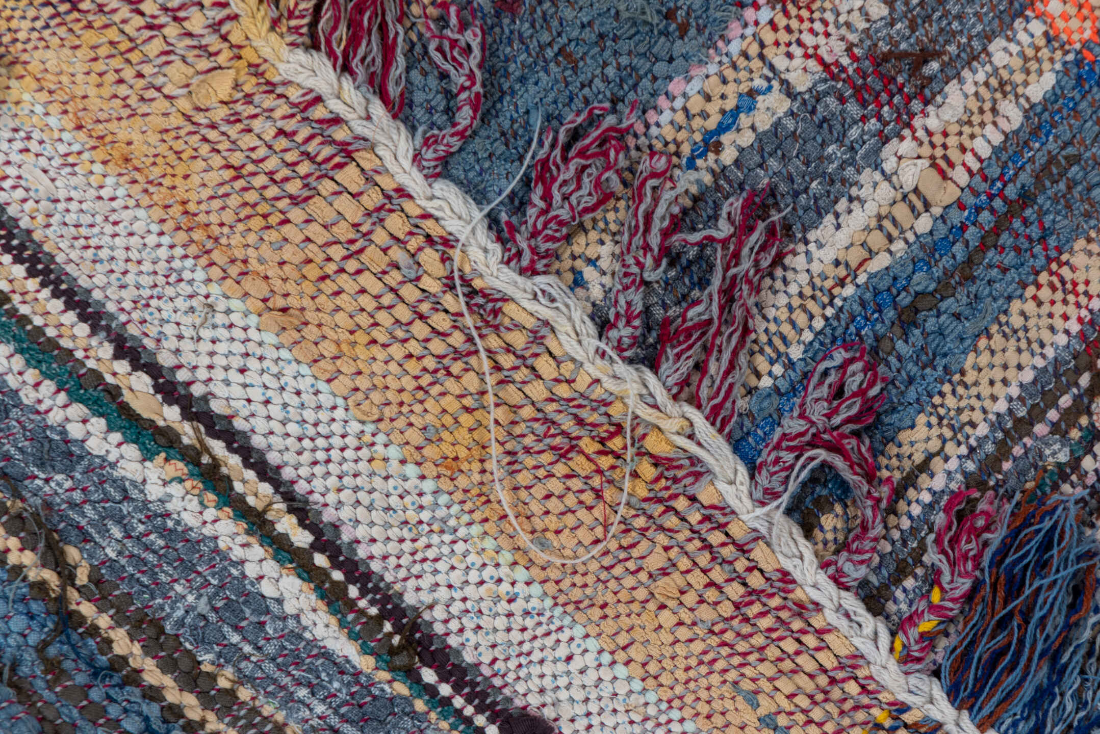 5' x 6' one-of-a-kind handmade vintage Textile rug. Color palette: blue, brown, gray, light gray, off-white, pink, red