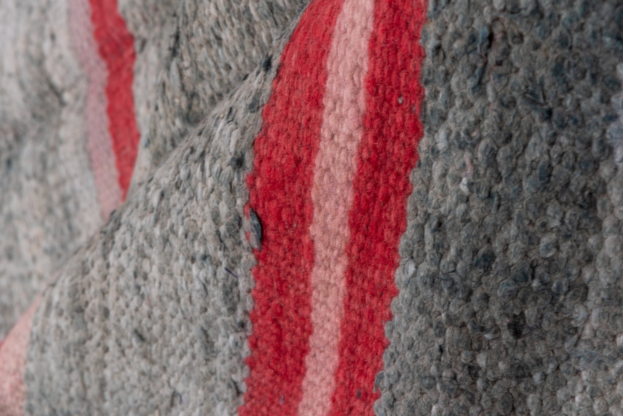 5' x 9' one-of-a-kind handmade vintage Blanket medium size rug. Color palette: brown, gray, light gray, off-white, pink, red