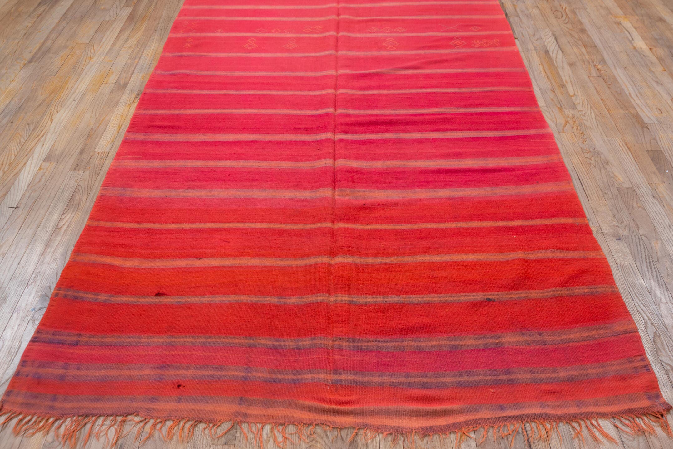 5' x 12' one-of-a-kind handmade vintage Blanket rug. Color palette: rose, crimson, terra cotta, taupe, plum, pink, red