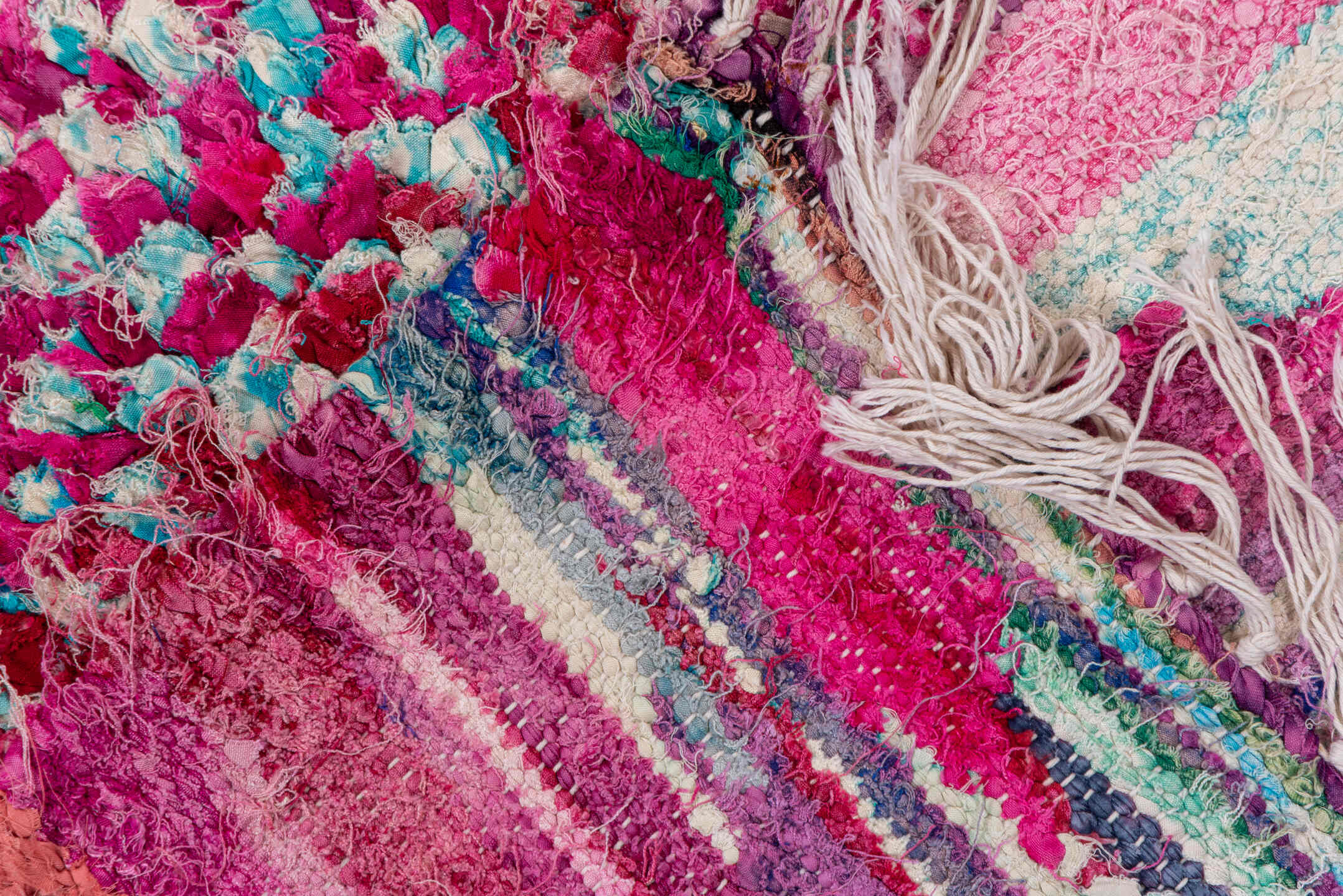 4' x 9' one-of-a-kind handmade vintage Rag Rug rug. Color palette: pink, turquoise, ivory, burgundy, rose, taupe, gold, teal