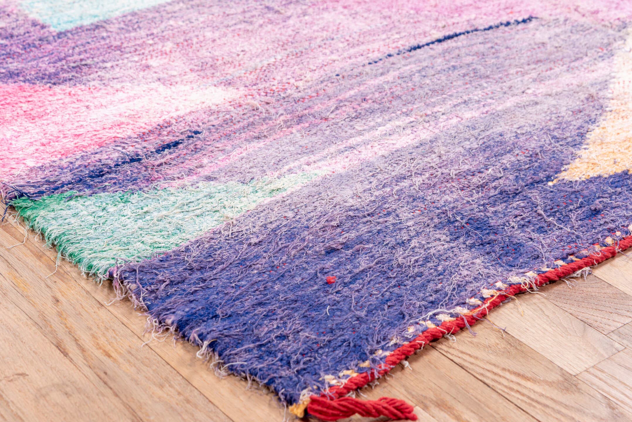 4' x 8' one-of-a-kind handmade vintage Rag Rug rug. Color palette: lavender, plum, pink, aqua, raspberry, mint, peach, ivory