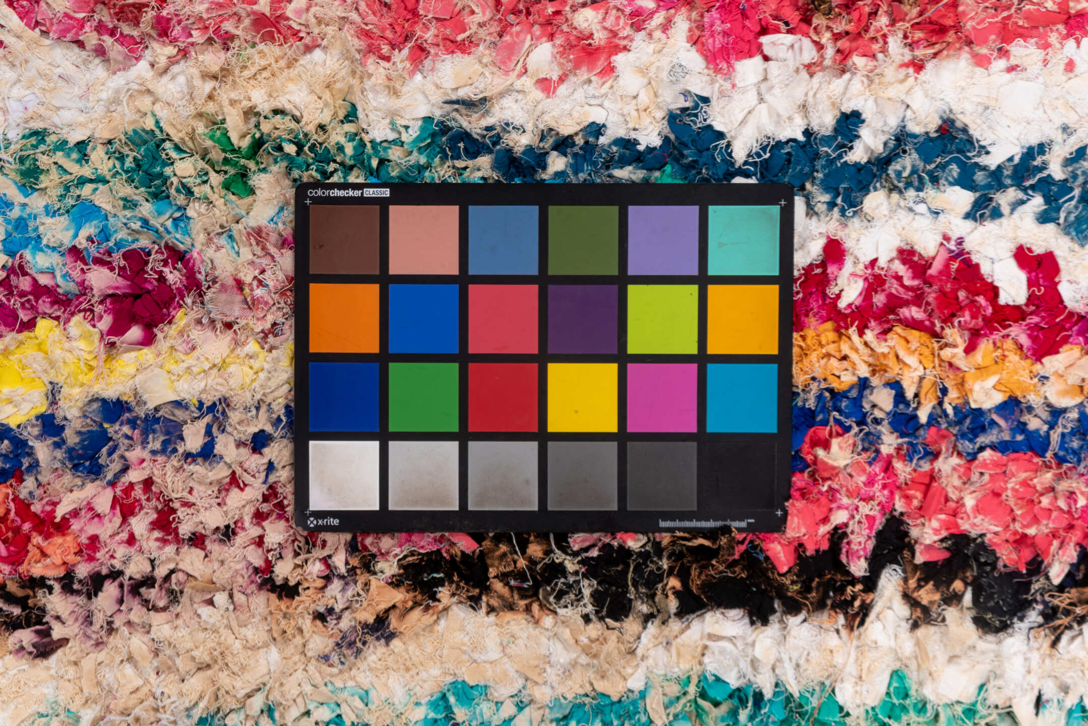 4' x 8' one-of-a-kind handmade vintage Rag Rug rug. Color palette: ivory, magenta, turquoise, cobalt, black, rose, lavender