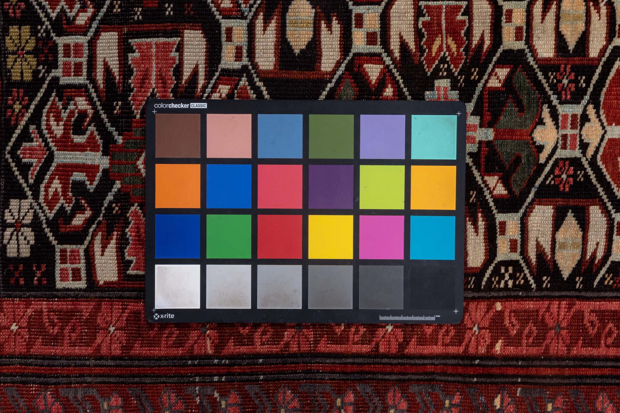 4' x 7' one-of-a-kind handmade vintage Kuba rug. Color palette: black, brown, gray, pink, red