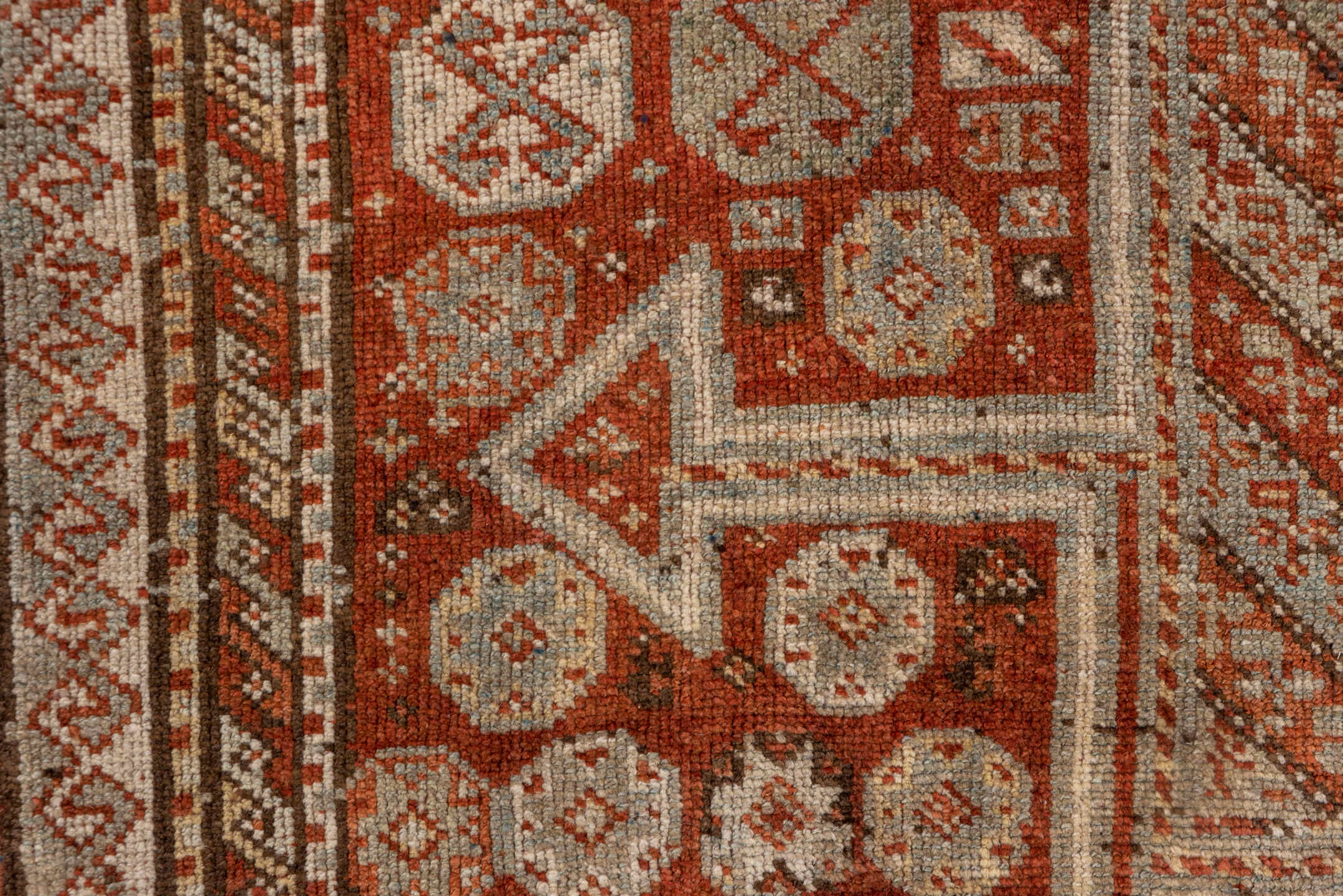 4' x 7' one-of-a-kind handmade antique Kurd rug. Color palette: rust, ivory, terra cotta, brown, taupe, charcoal, terracotta