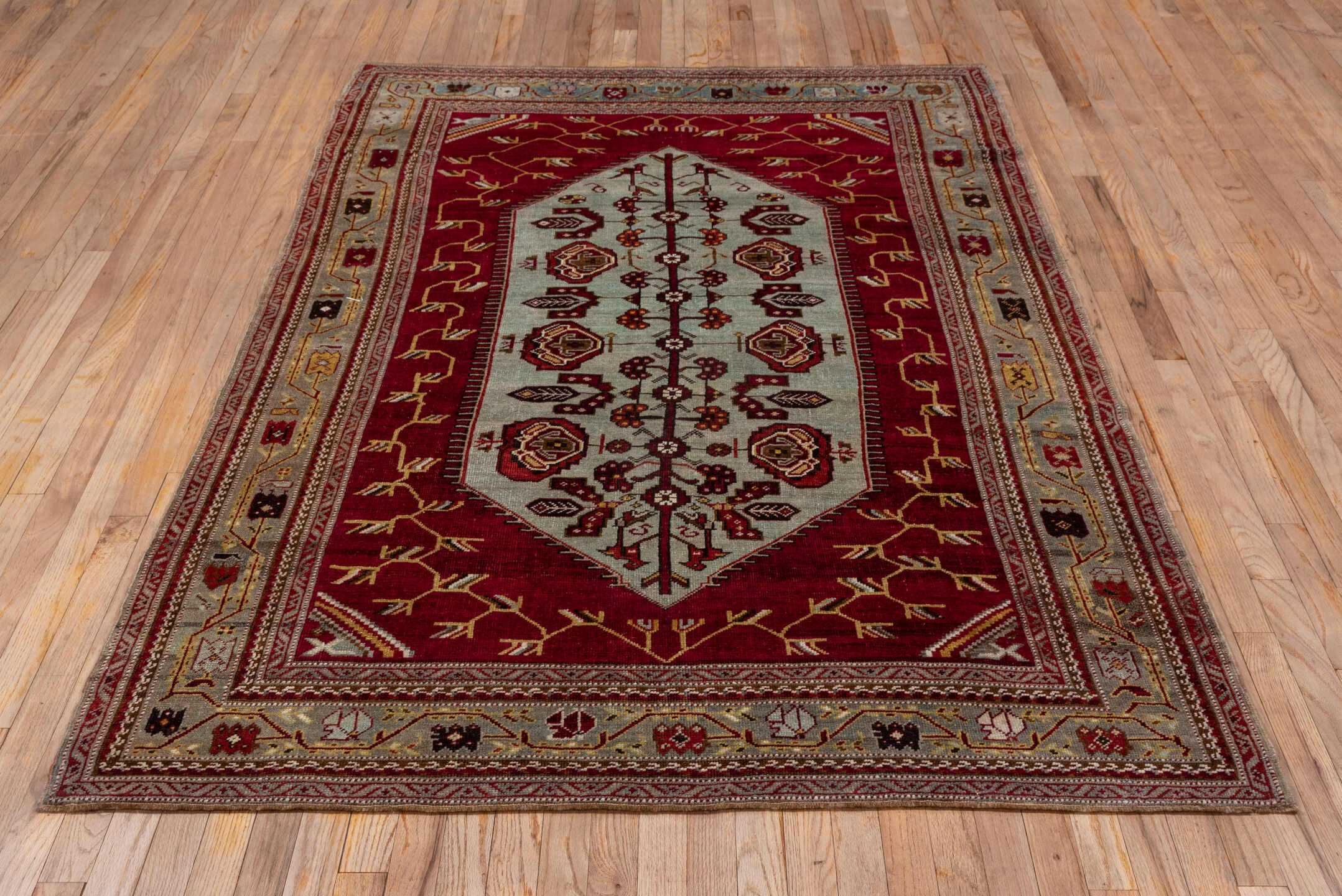 5' x 7' one-of-a-kind handmade antique Oushak rug. Color palette: red, ivory, burgundy, camel, gold, brown, beige