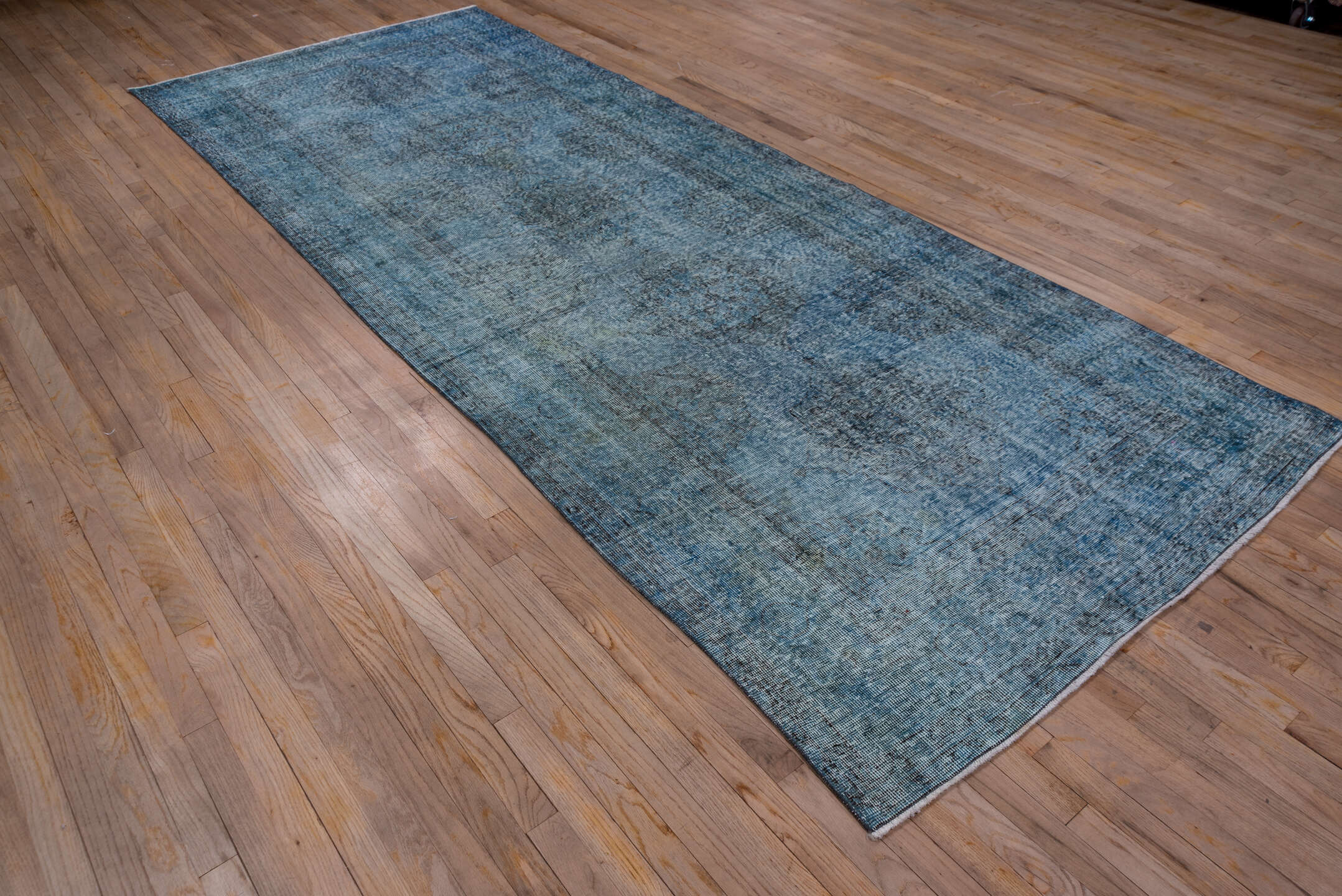 4' x 12' one-of-a-kind handmade vintage Overdyed runner rug. Color palette: arapawa, black, blue, gray, light blue