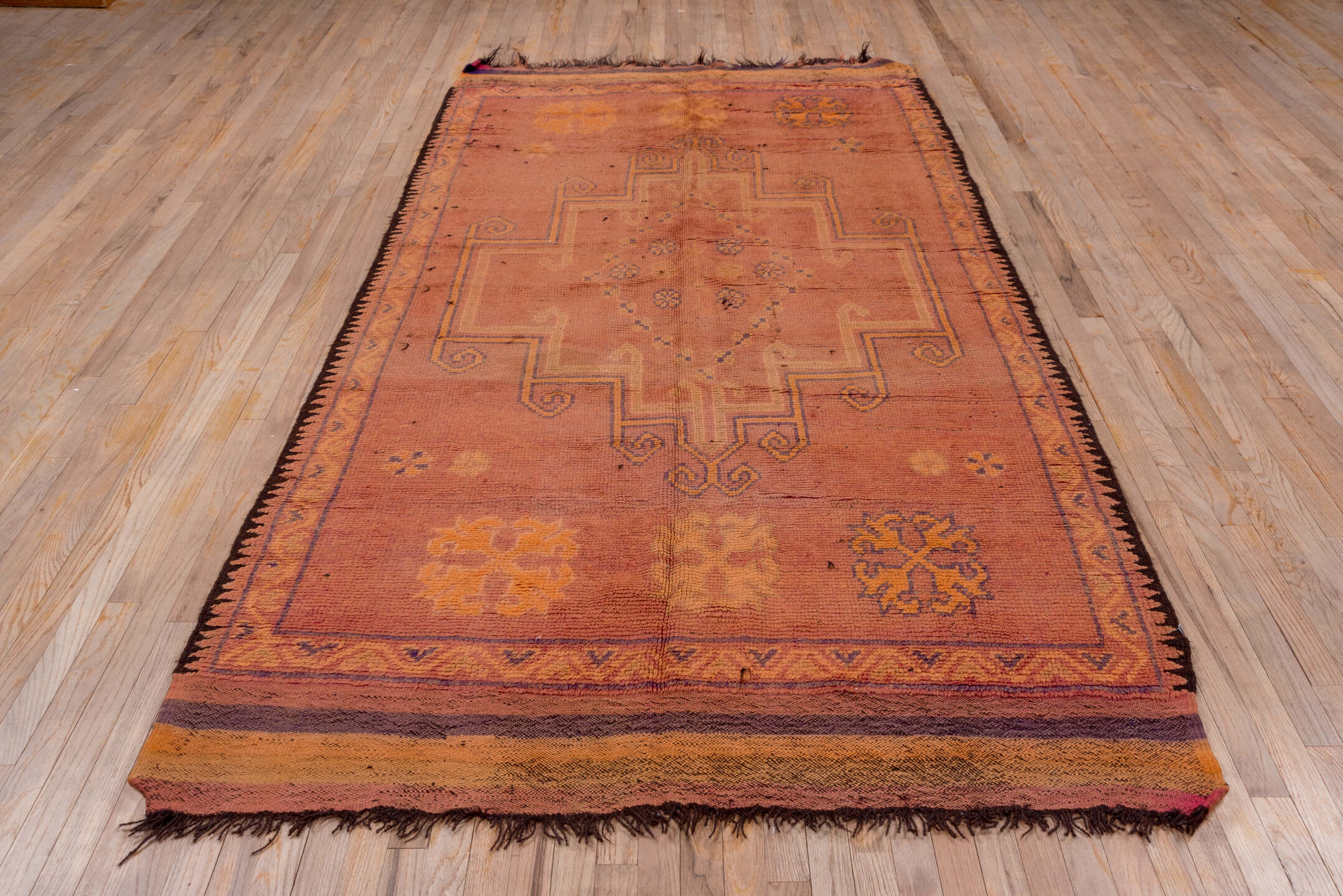 5' x 10' one-of-a-kind handmade vintage Moroccan medium size rug. Color palette: brown, gray, light gray, off-white, pink