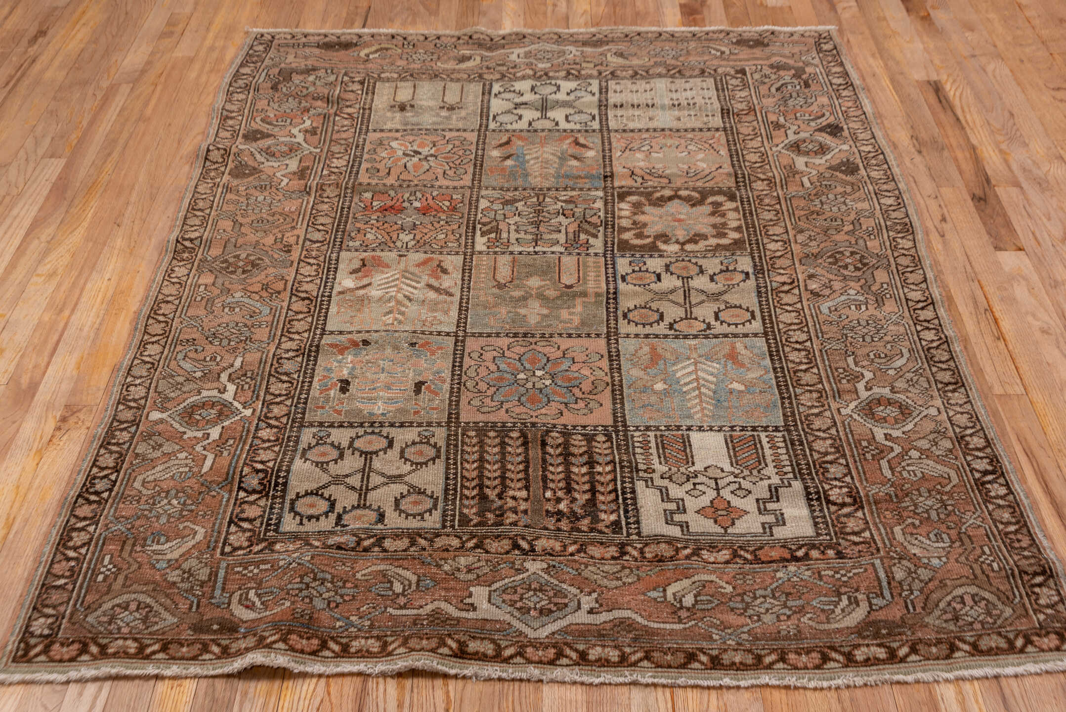4' x 6' one-of-a-kind handmade antique Baktiary small size rug. Color palette: taupe, rose, brown, ivory, muted blue