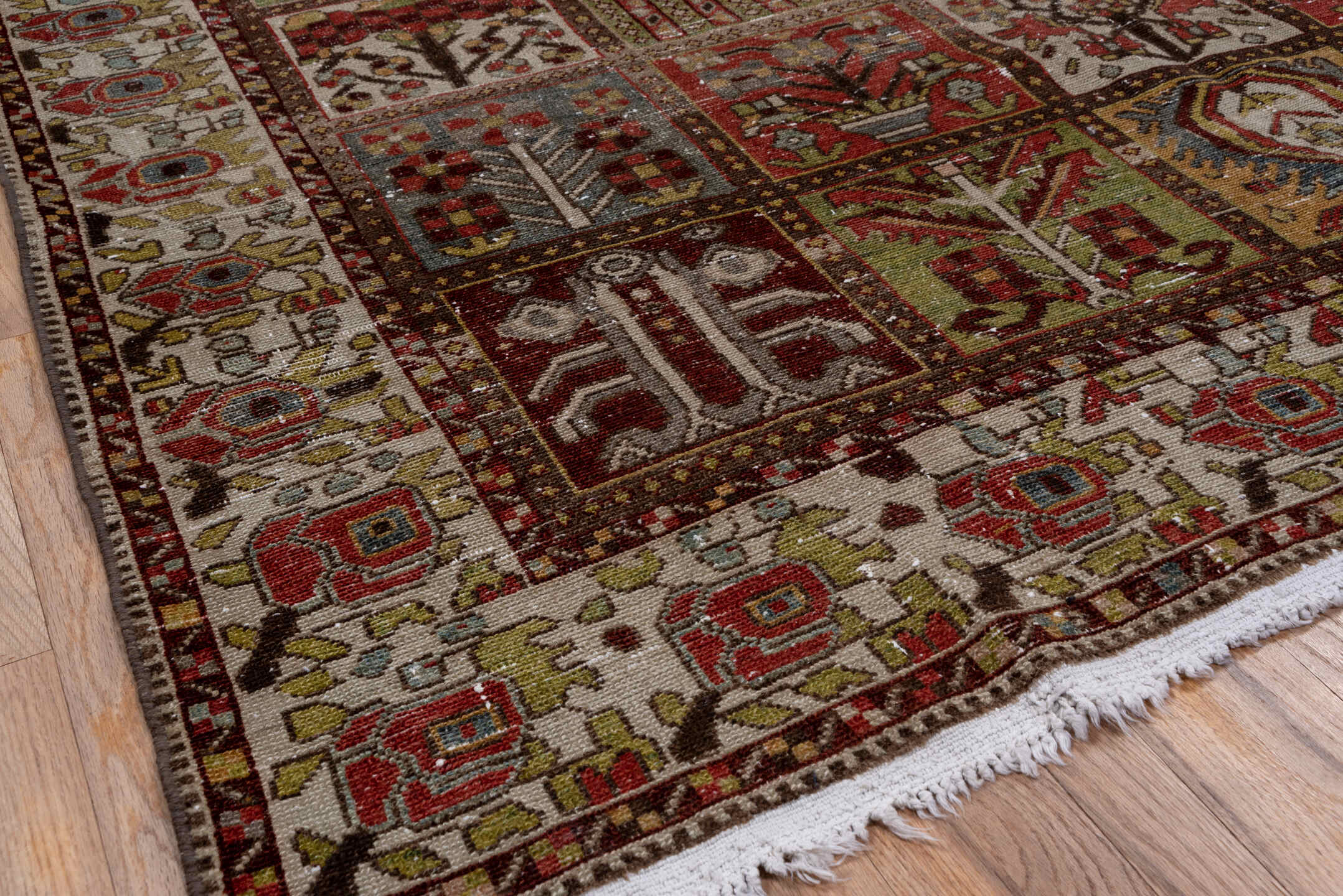 6' x 10' one-of-a-kind handmade antique Baktiary large size rug. Color palette: ivory, rust, olive, burgundy, blue, taupe