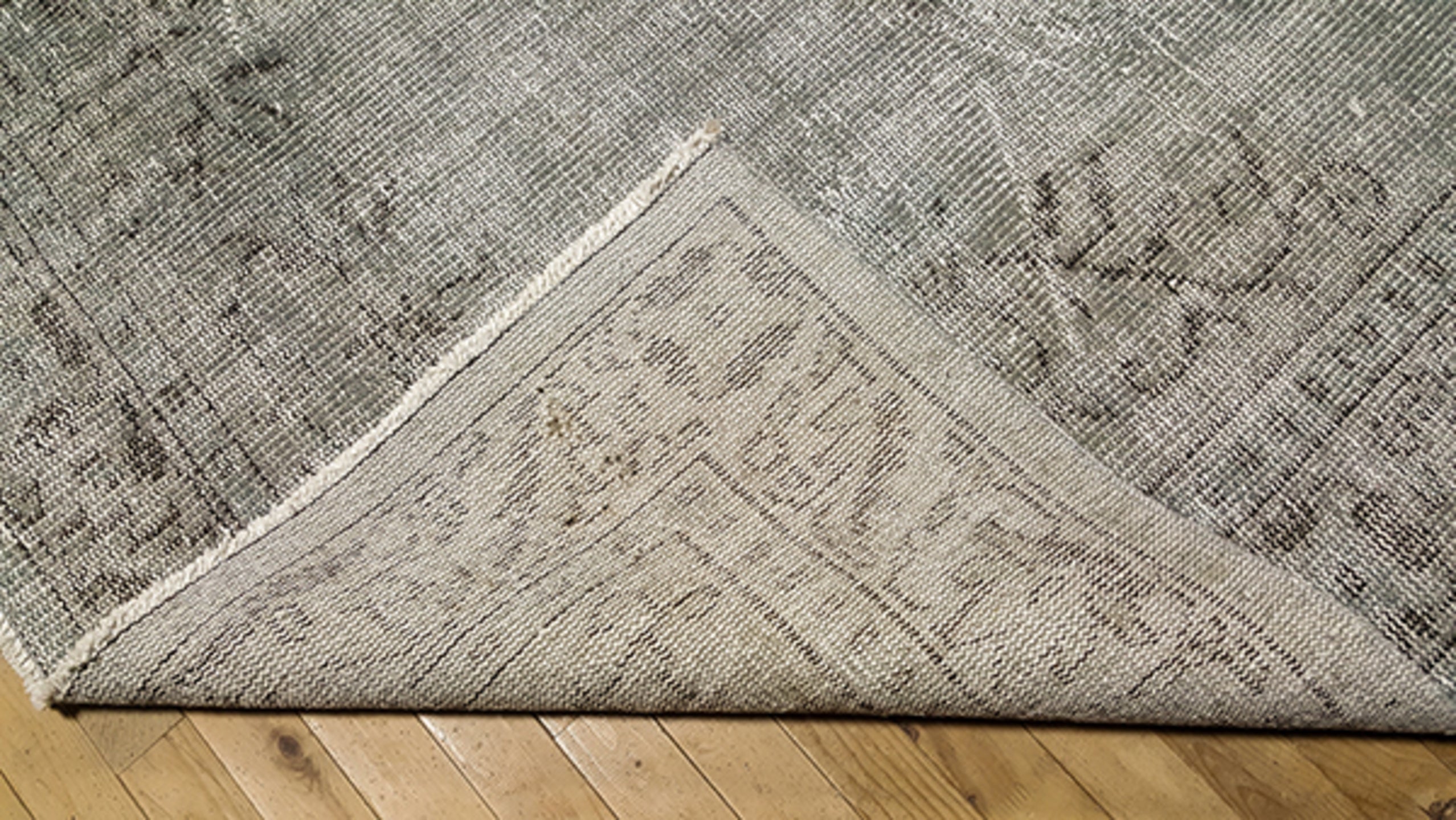 5' x 9' one-of-a-kind handmade vintage Overdyed medium size rug. Color palette: gray, taupe, charcoal, ivory, beige, black