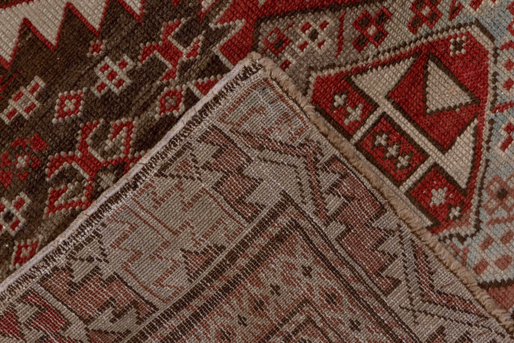 2' x 6' one-of-a-kind handmade vintage Shirvan runner rug. Color palette: brown, pink, red