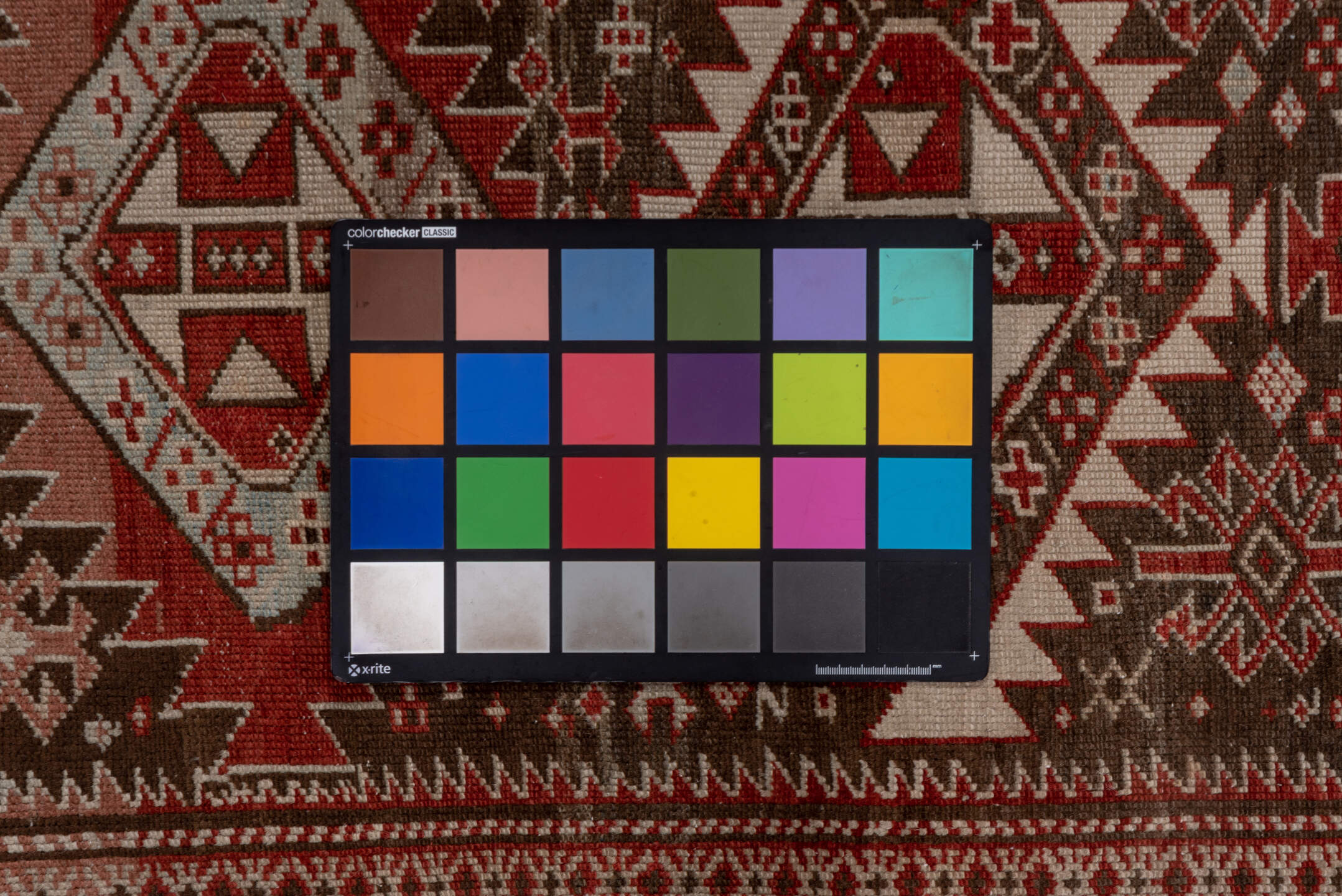 2' x 6' one-of-a-kind handmade vintage Shirvan runner rug. Color palette: brown, pink, red